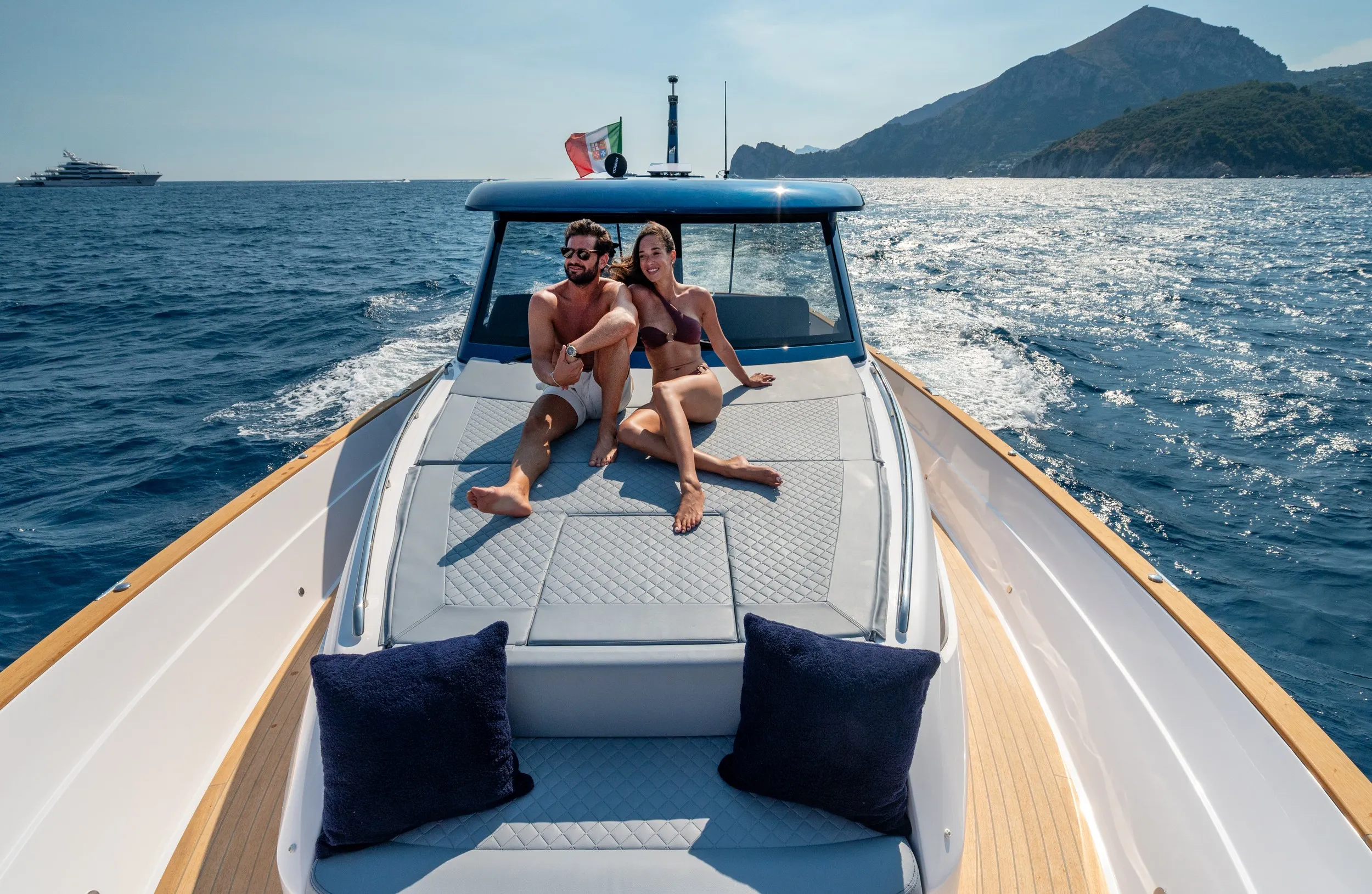 Bow sunpad with cushions on the foredeck at sea