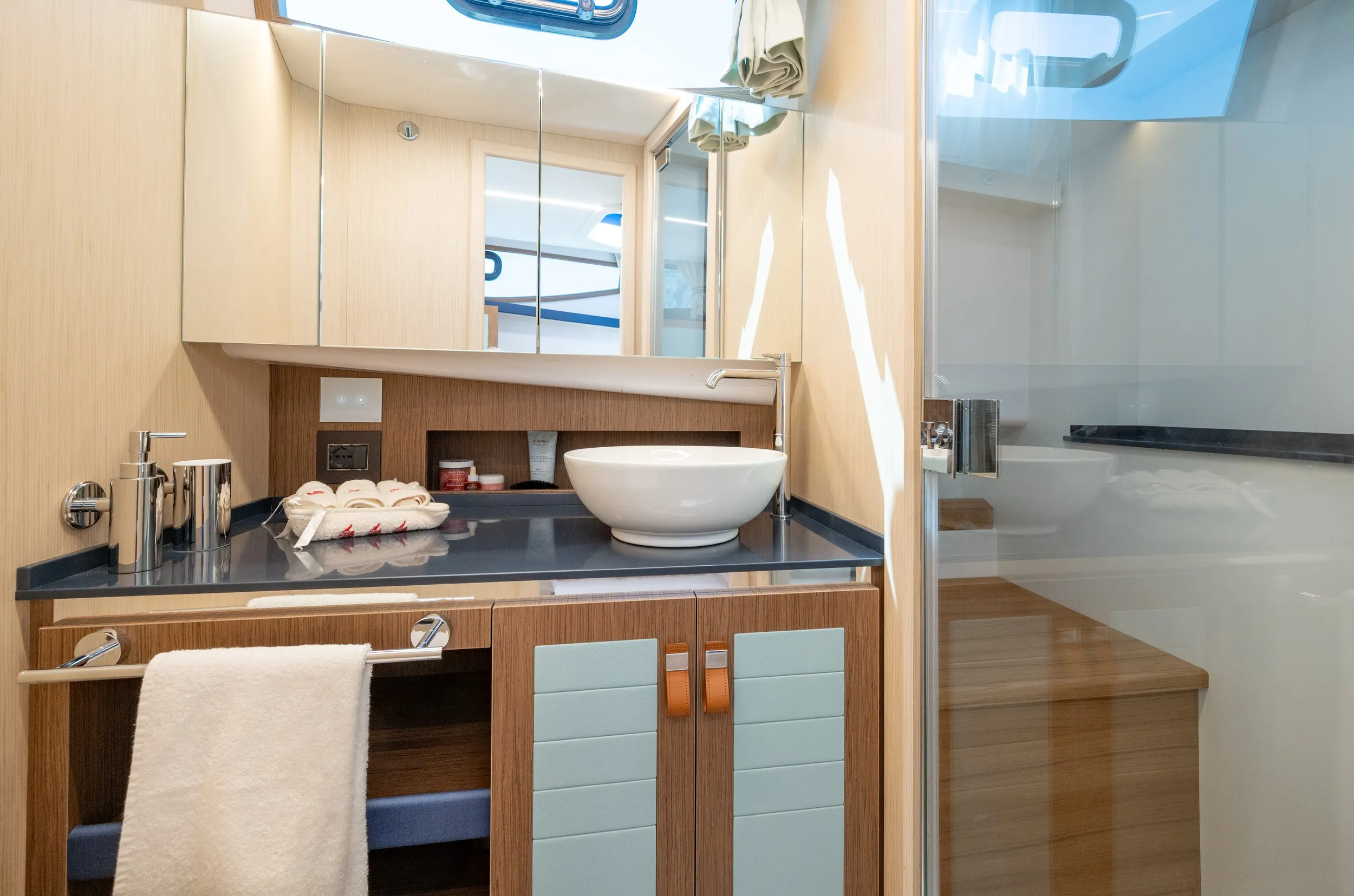 Bathroom with basin, mirror and shower enclosure
