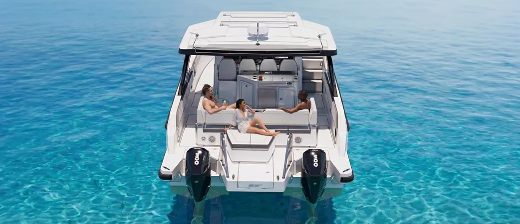Aft view of the 35 Sport at rest with people on the sunpad