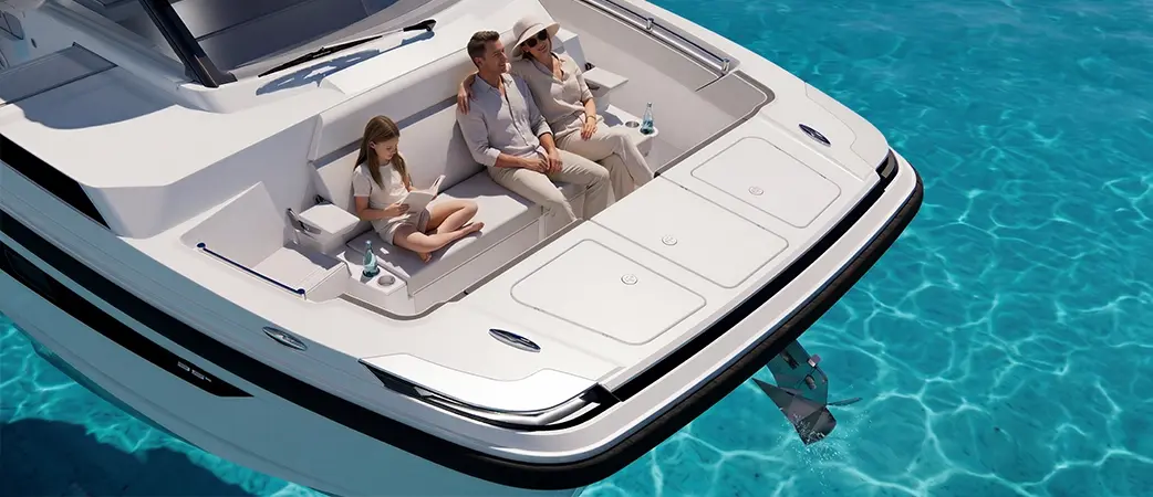 Bow seating area with four people seated over clear water