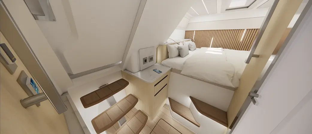 Cabin below deck with a berth and pale joinery