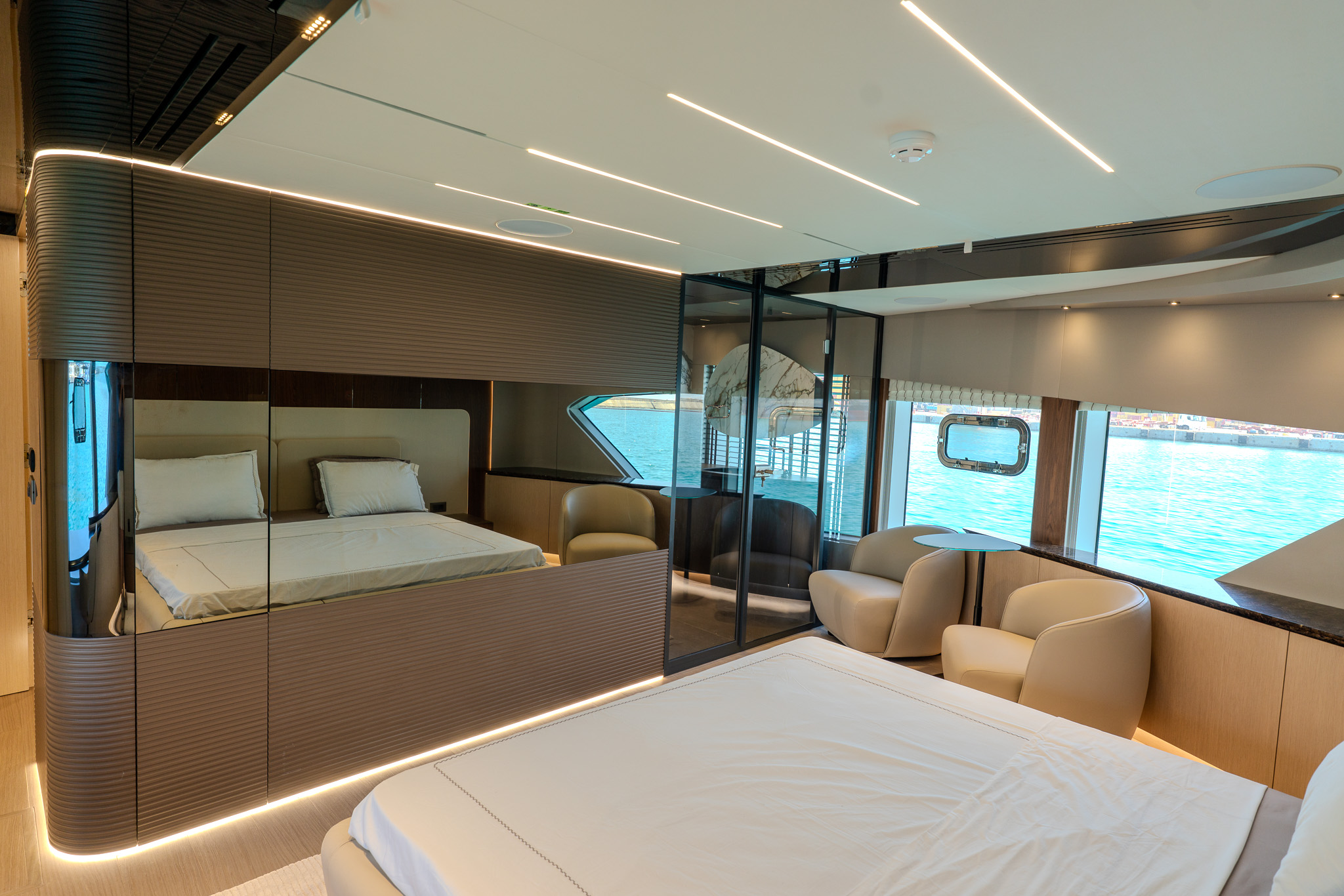 Owner’s cabin with a double bed and panoramic window onto the sea