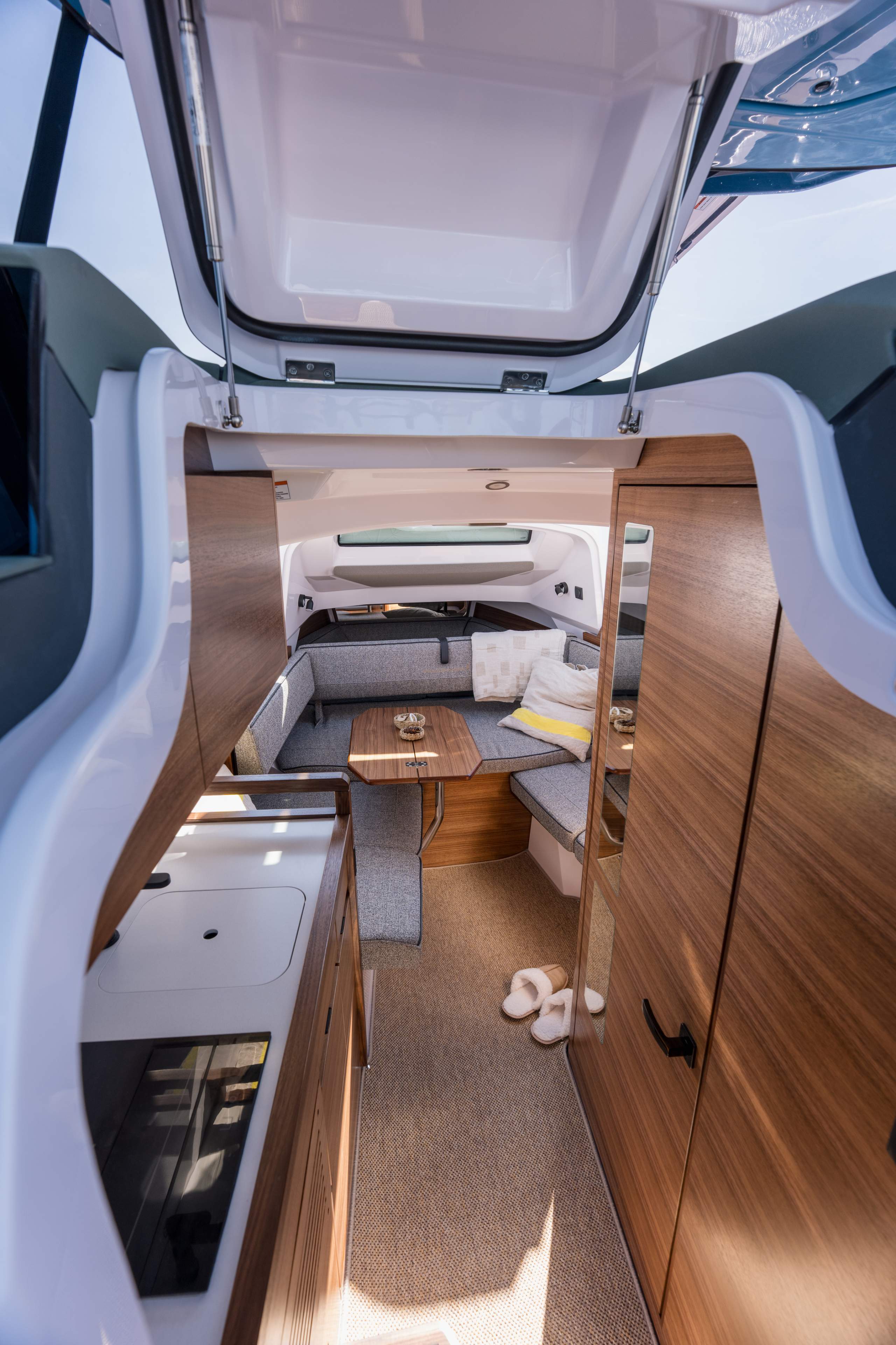Front cabin interior with berth, timber joinery and galley module