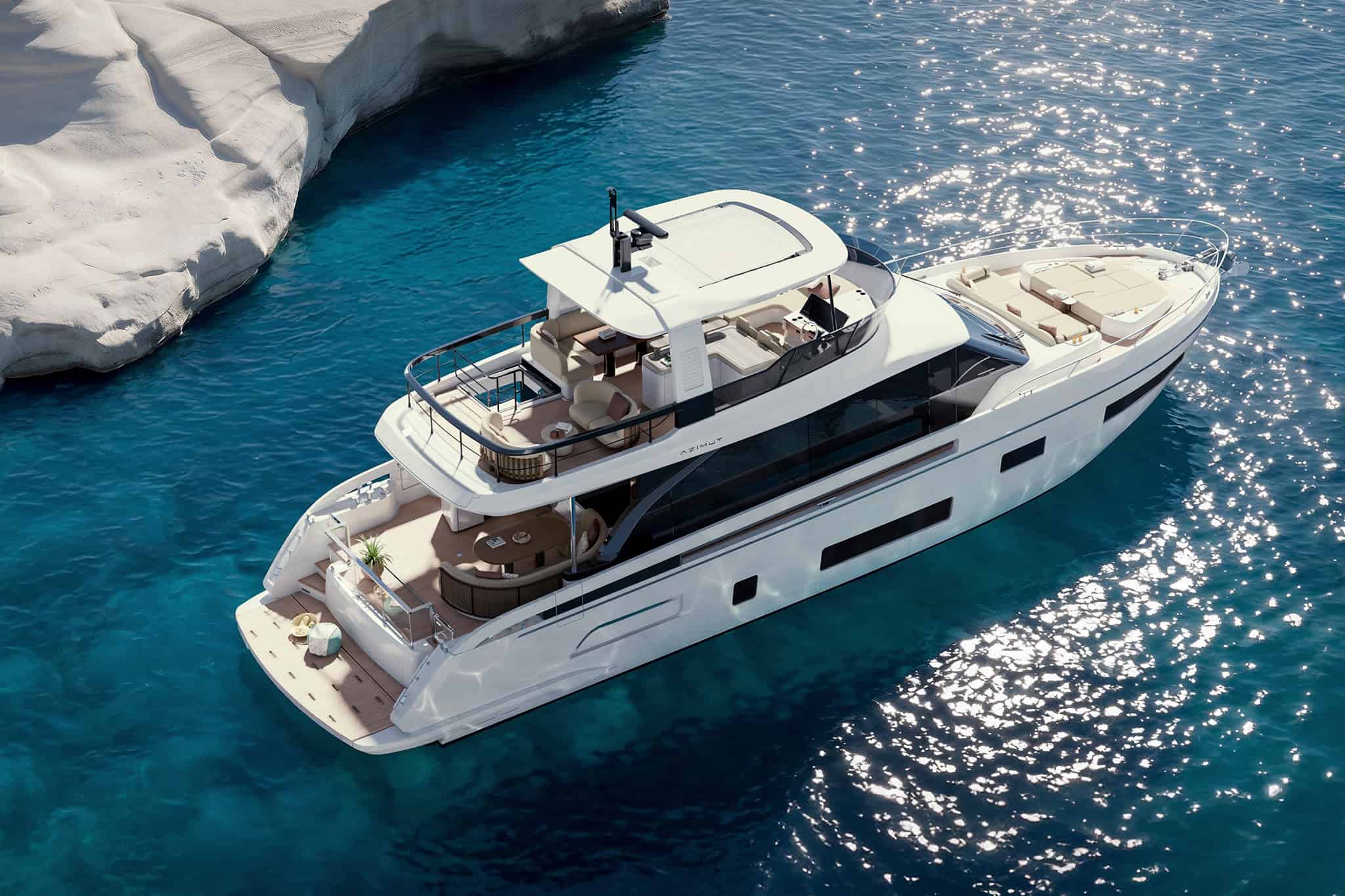 The Fly 70 seen from above and astern at anchor, the flybridge and its hardtop dominating the frame with the aft deck and swim platform below