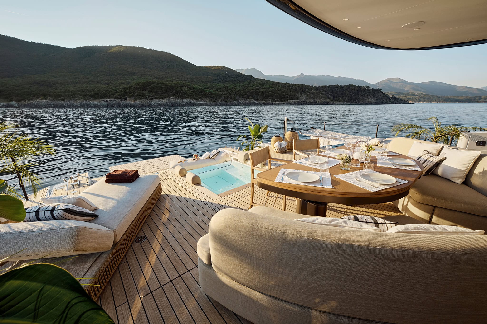 Terrace deck with dining table, loungers and the plunge pool