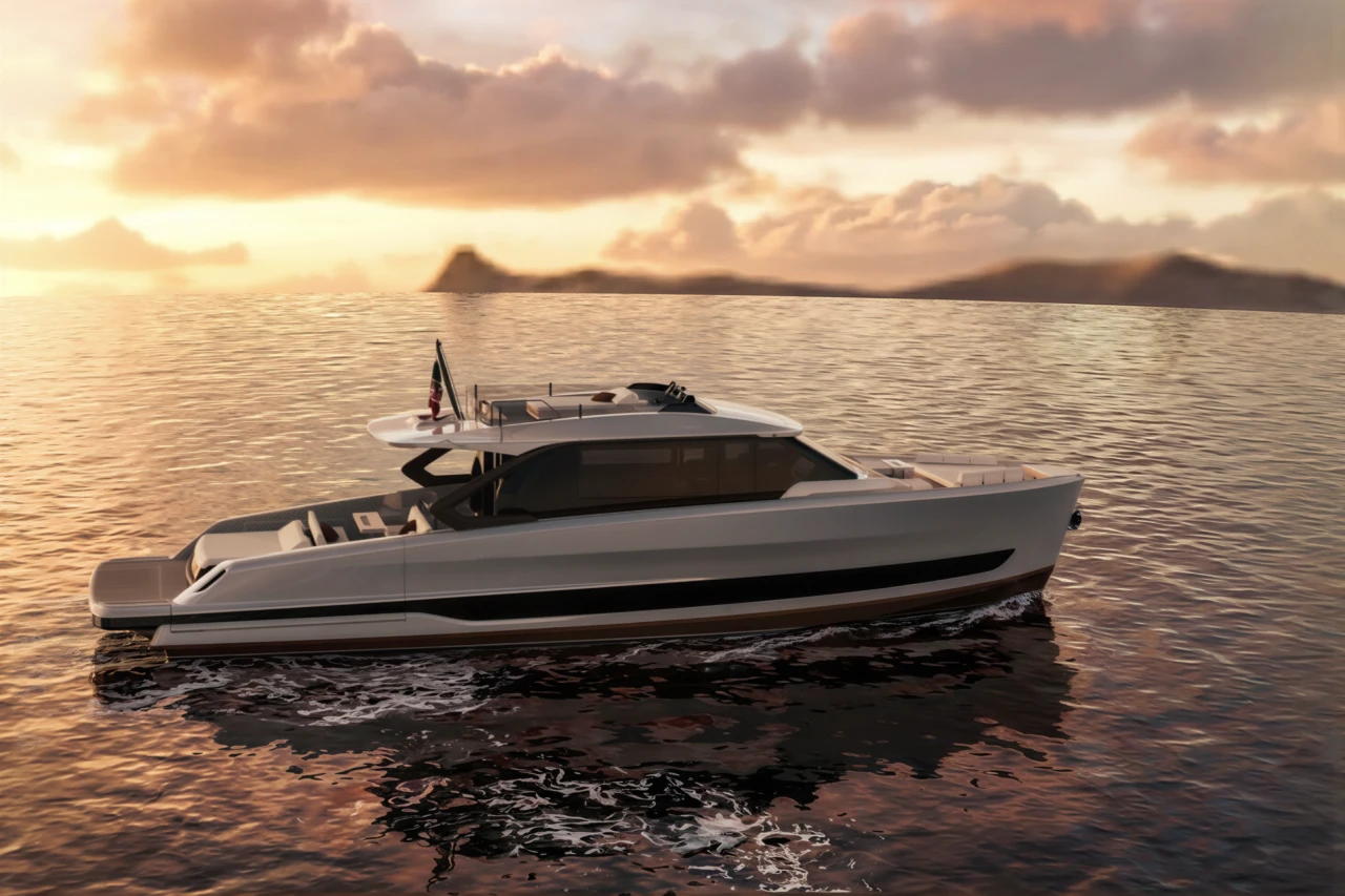The Astor 68 at rest in profile at sunset, with islands on the horizon.