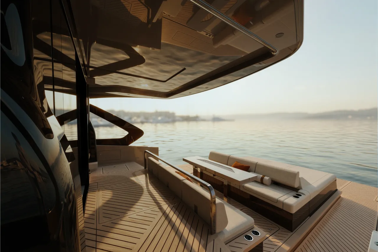 The aft cockpit beneath the extended hardtop, teak underfoot and facing sofas open to the sea.