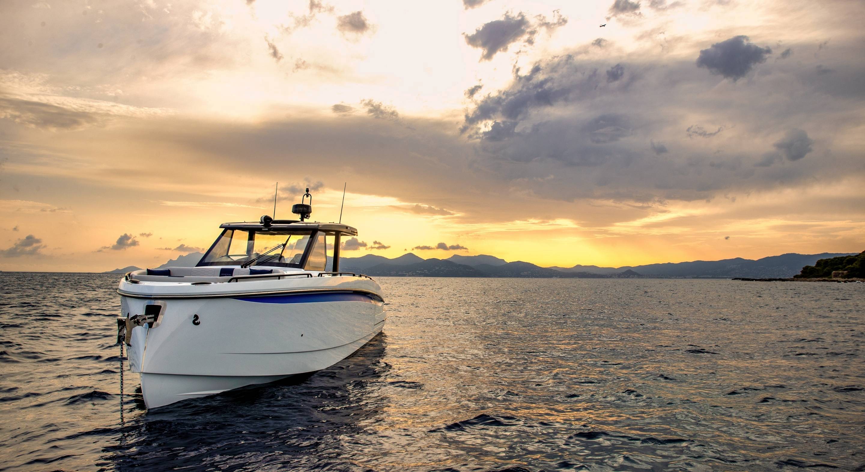 The boat at anchor at sunset