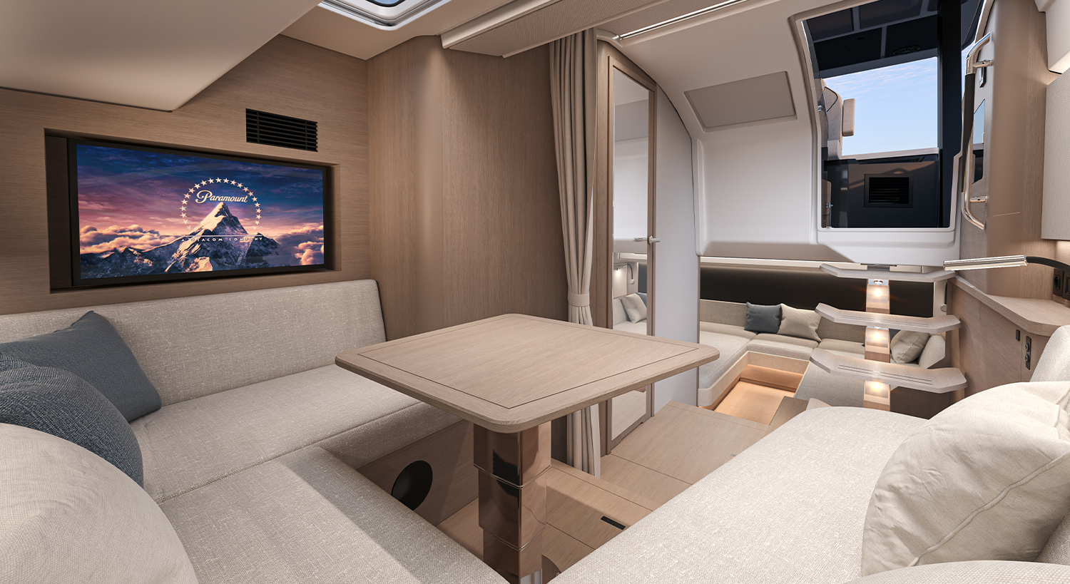 Interior saloon with dinette seating and a screen