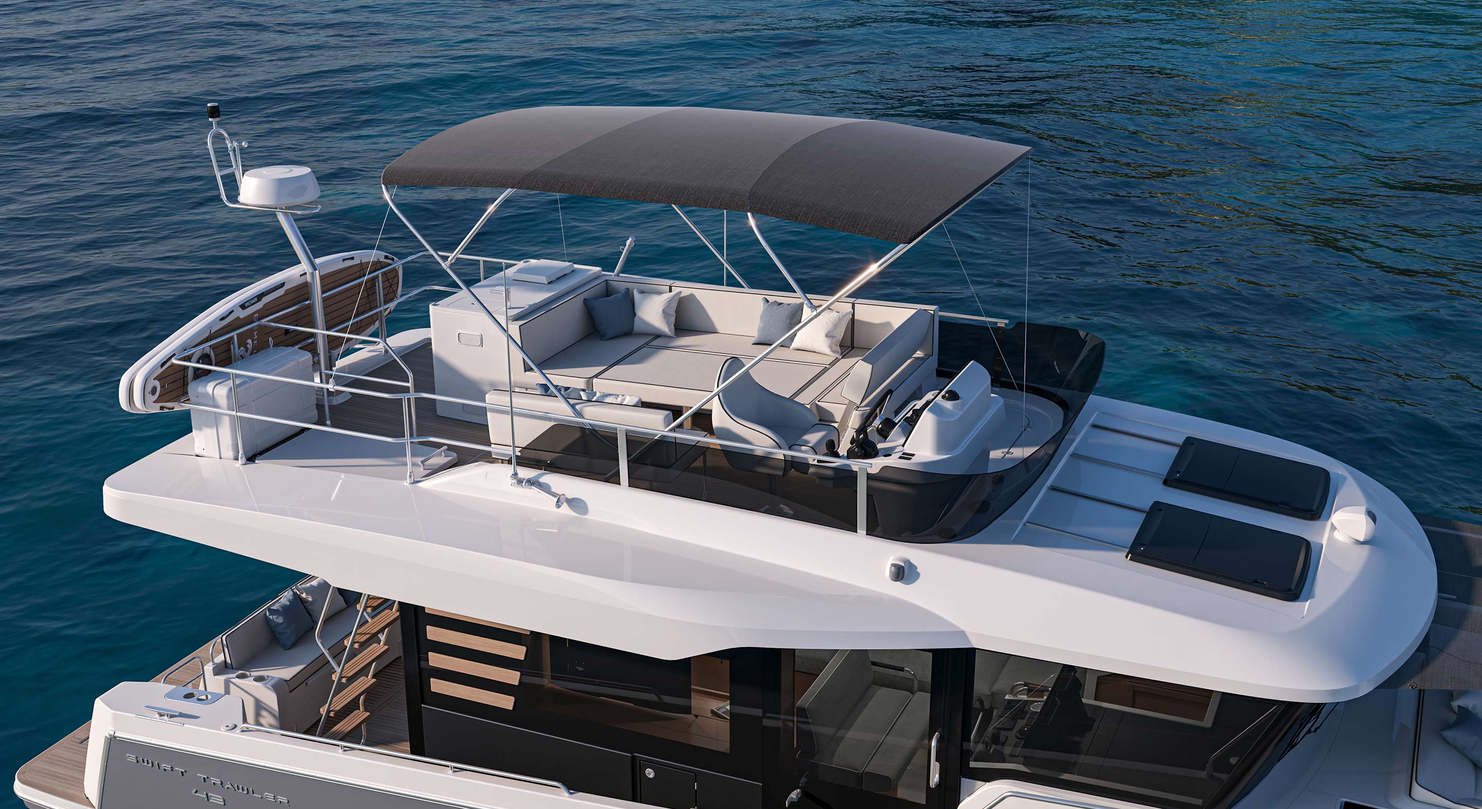 The flybridge seen from above, laid out with the U-shaped seat and loungers