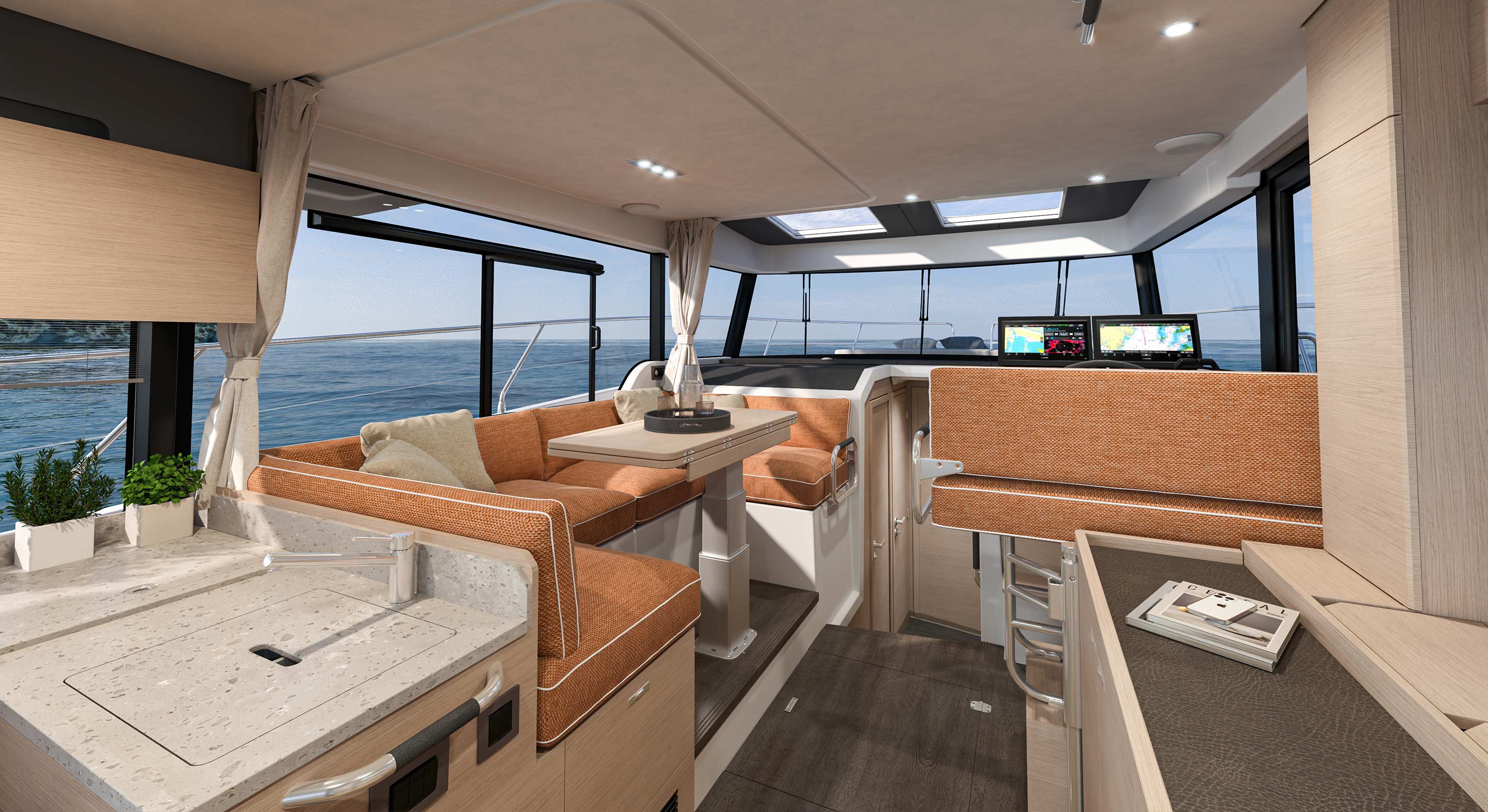 The saloon dinette with upholstered seating beside the galley counter