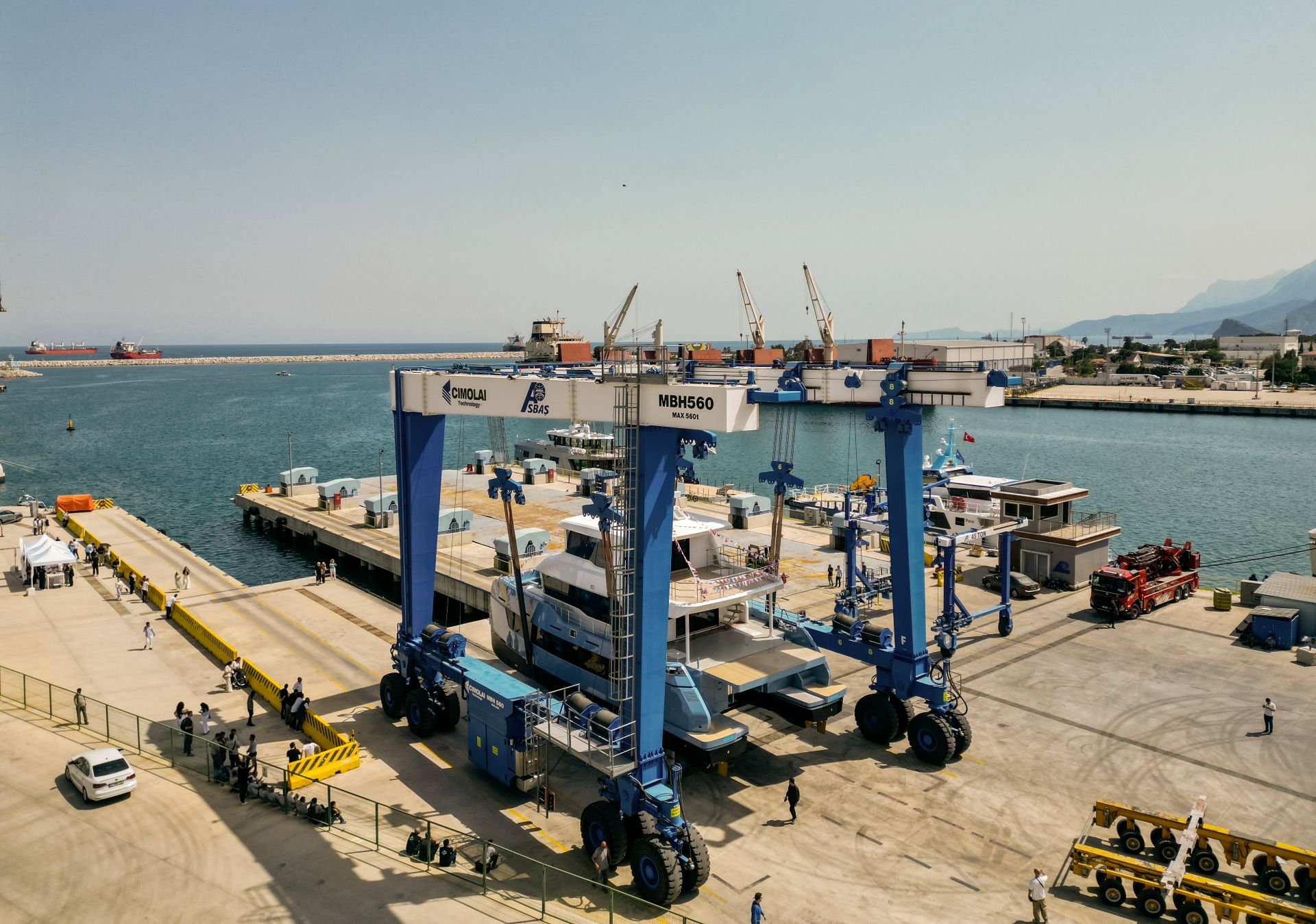 The BC60 held in a travel lift above the water at the shipyard quay