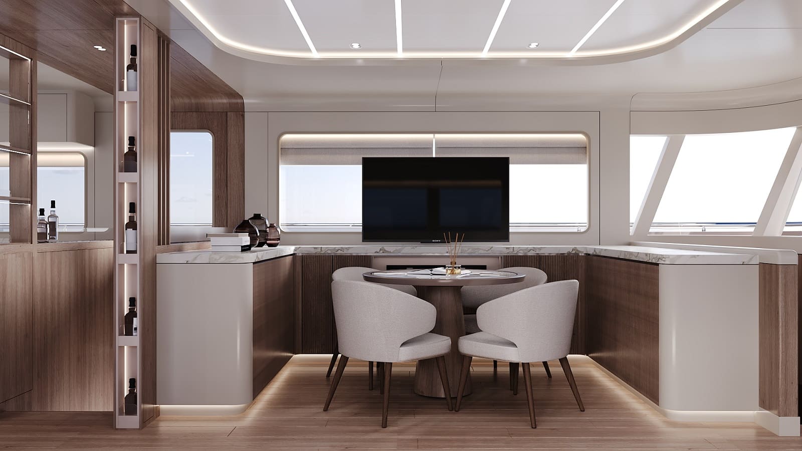The dining table and screen at the forward end of the saloon