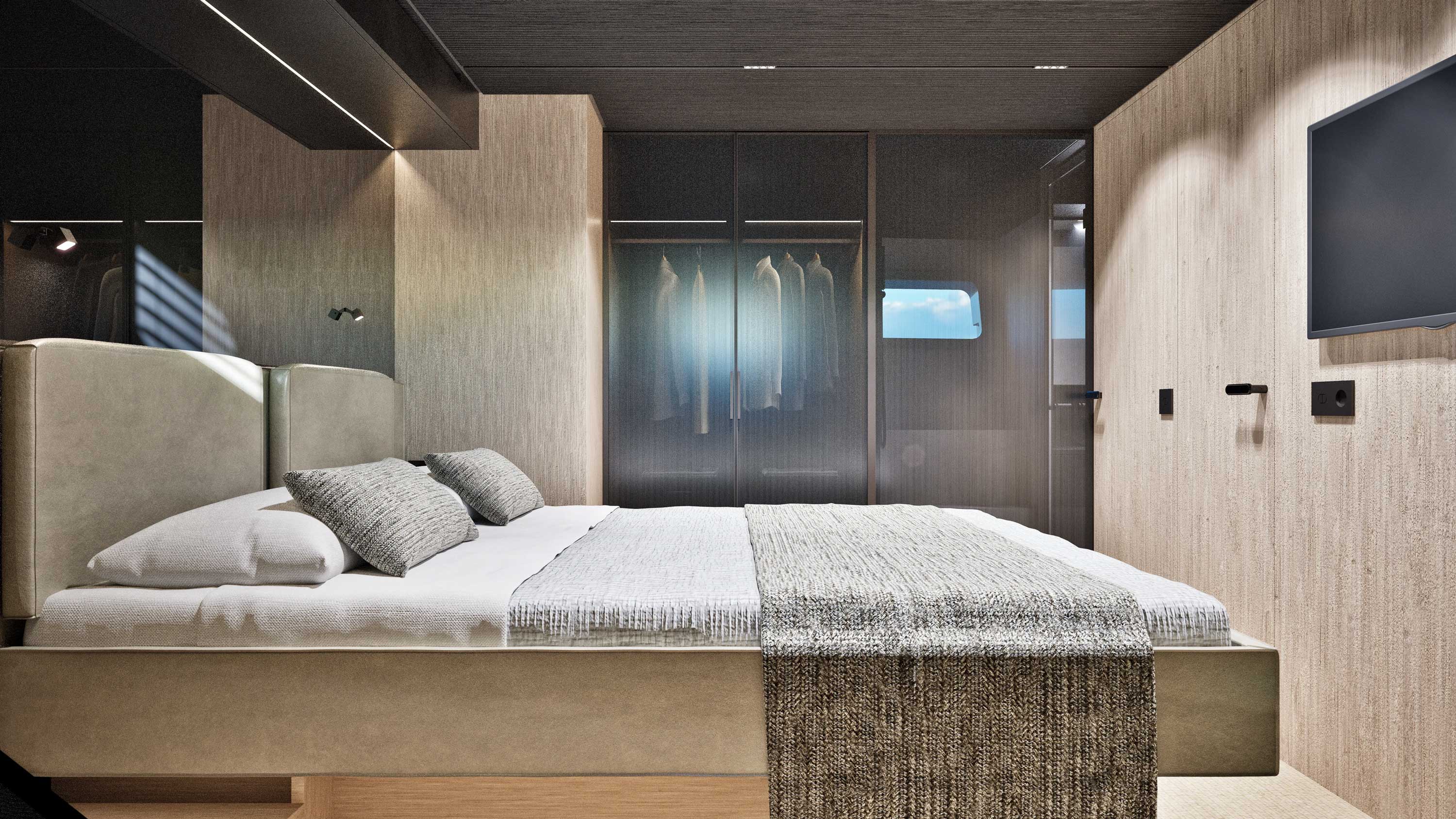 The master cabin with a double berth, a screen and a wardrobe