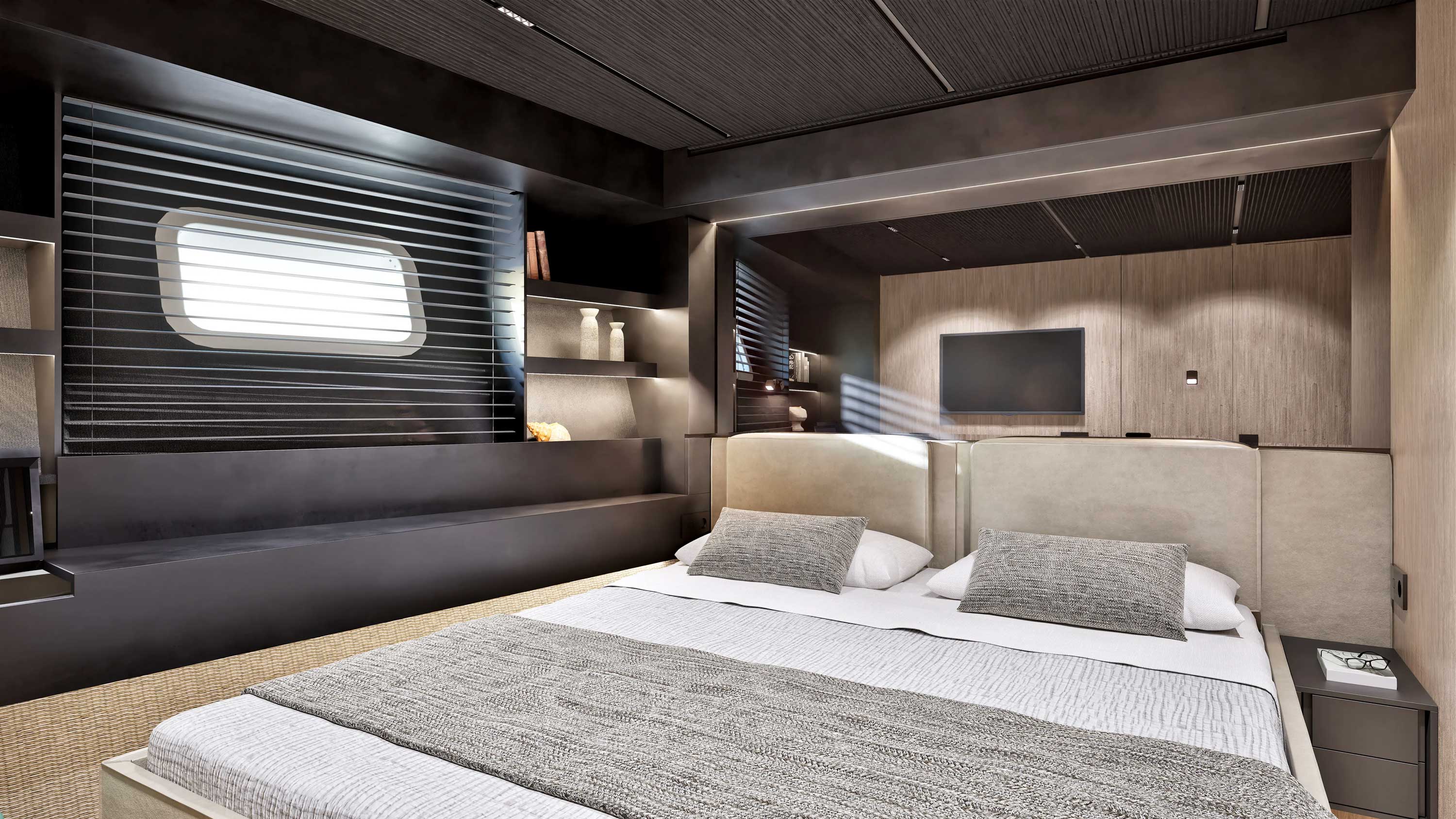A guest cabin with a double berth beside a hull window