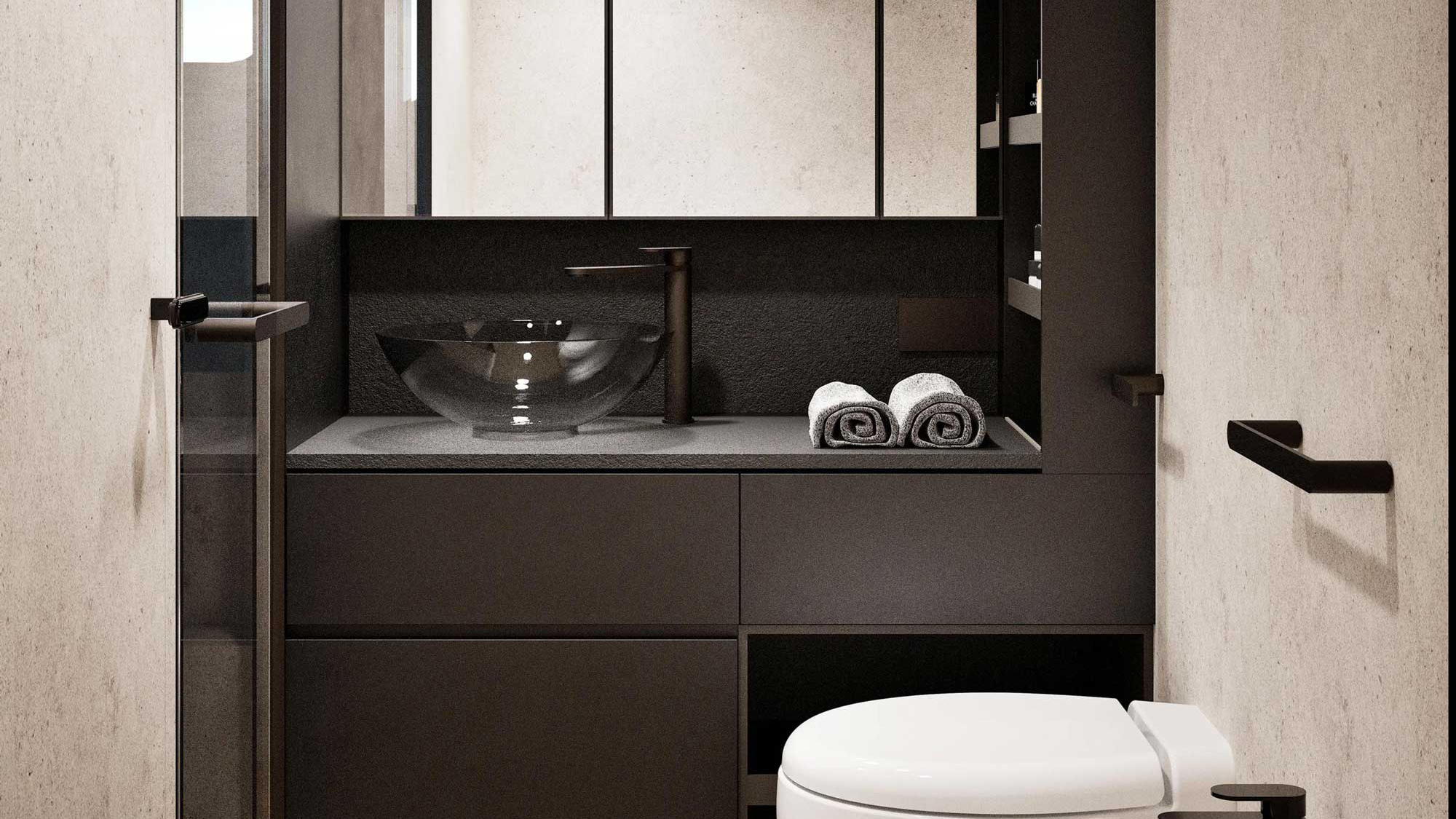 A bathroom with a stone basin, mirror and folded towels