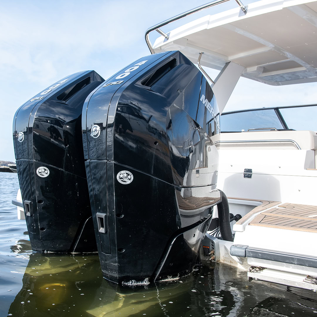 Twin black outboards mounted on the transom
