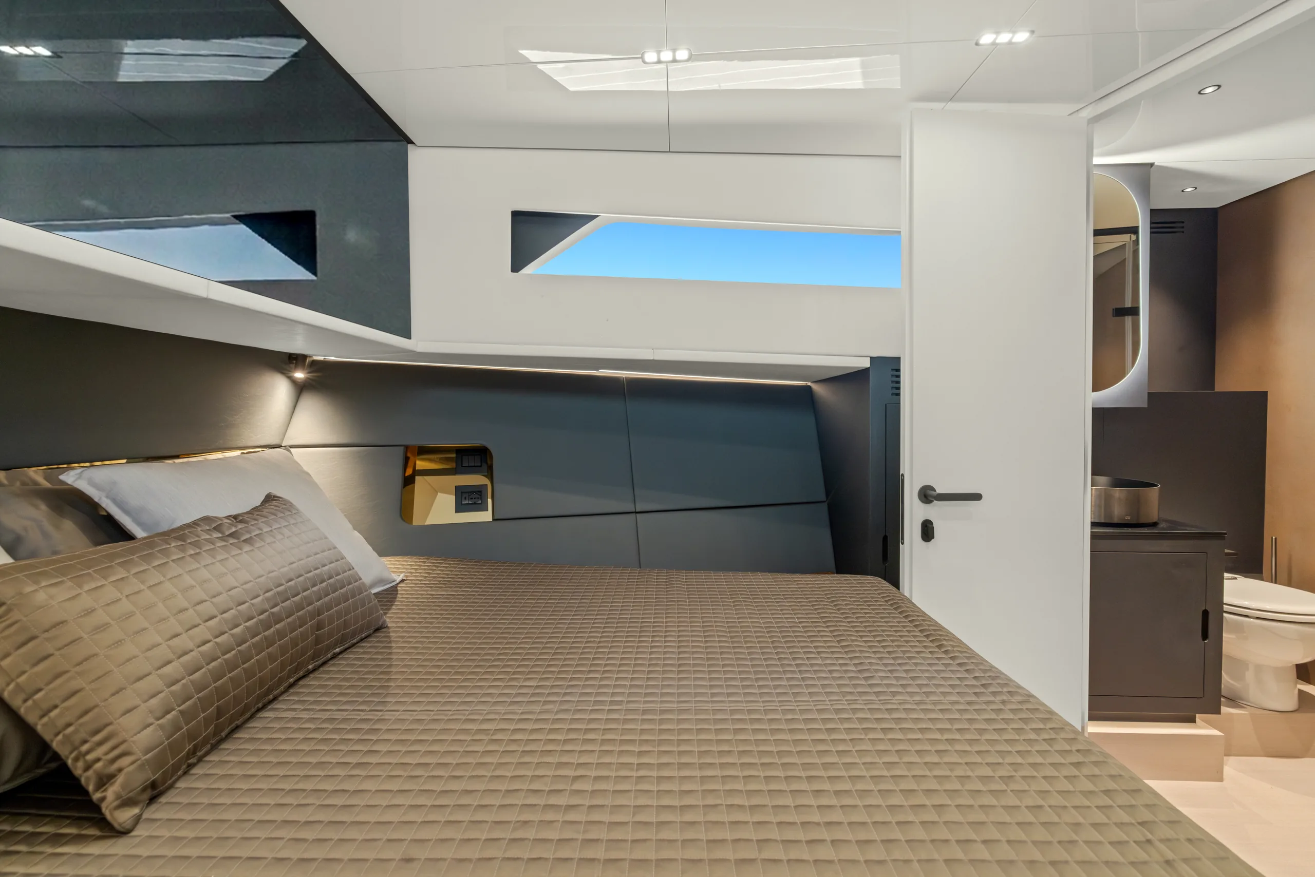 A second cabin, with a door open to a bathroom beyond