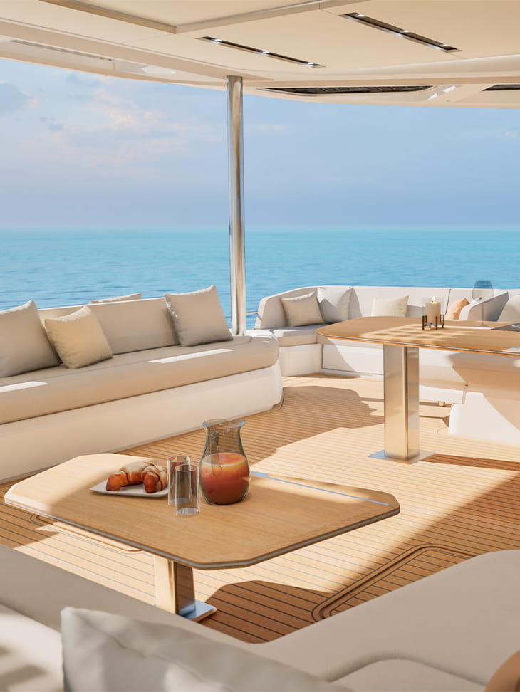 A shaded deck lounge with a low table set for drinks
