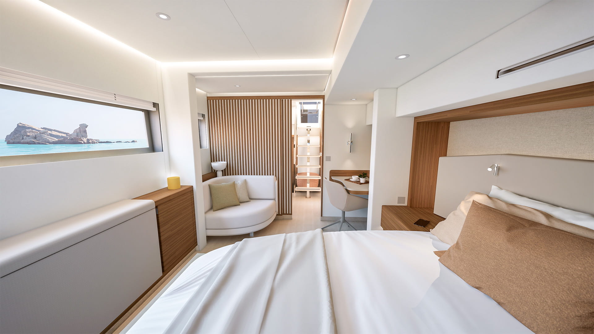 A cabin with a double berth, a seat and a long hull window