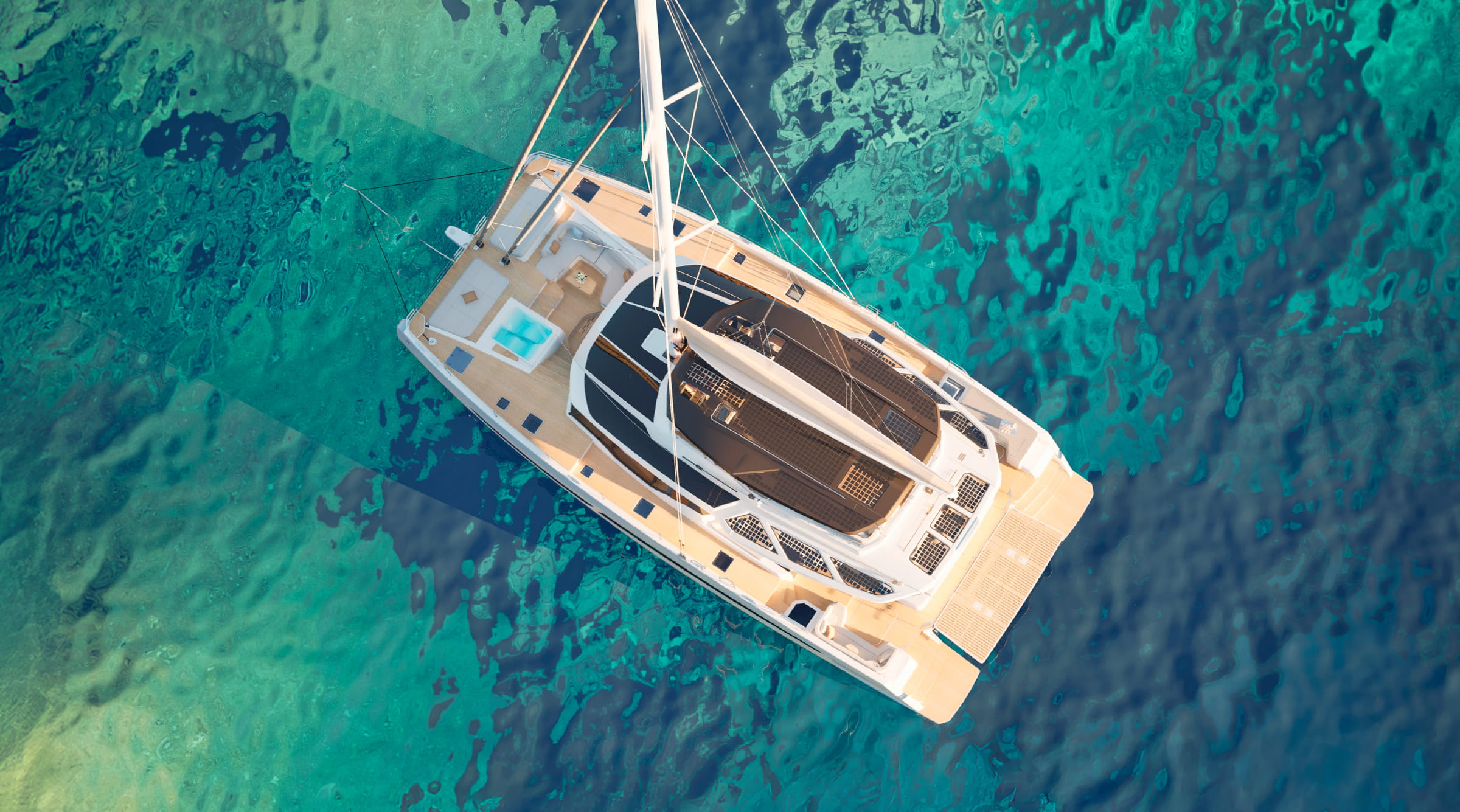 From above at anchor in clear green water, the tenders stowed aft