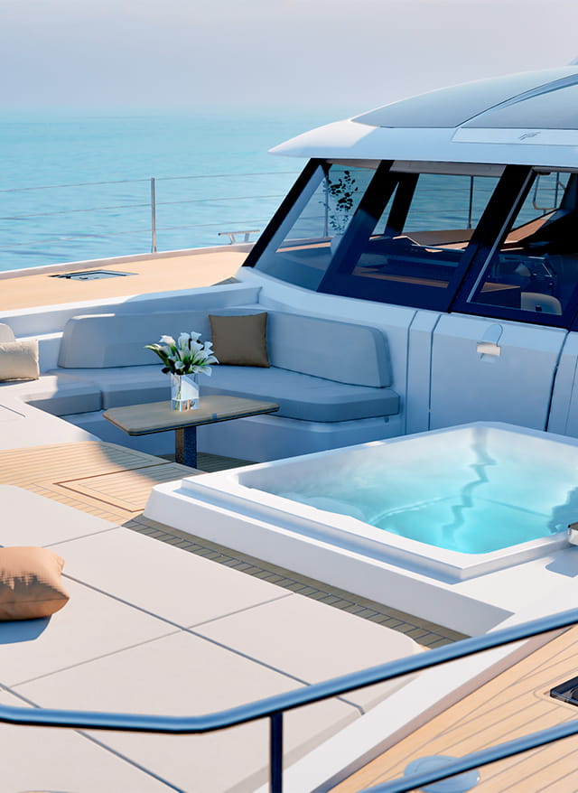 The flybridge with a spa pool set into the deck beside a curved settee
