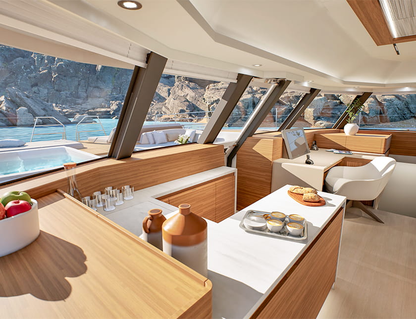 The galley island with fruit set out and the dining table beyond it