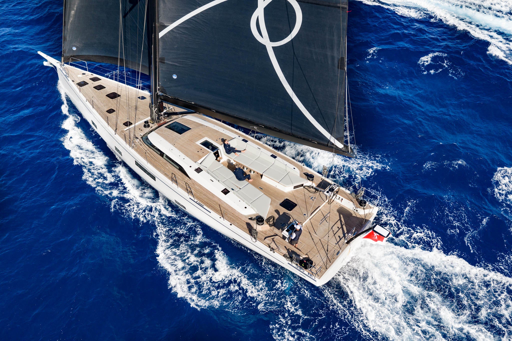 Seen from above under way, the deck and dark sails in full view