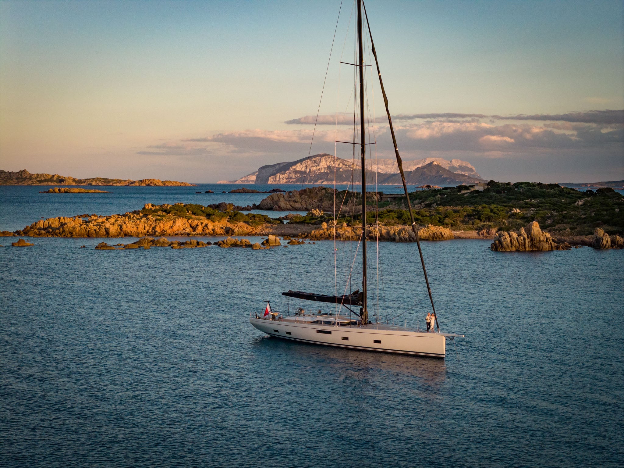 At anchor at dusk with an island beyond