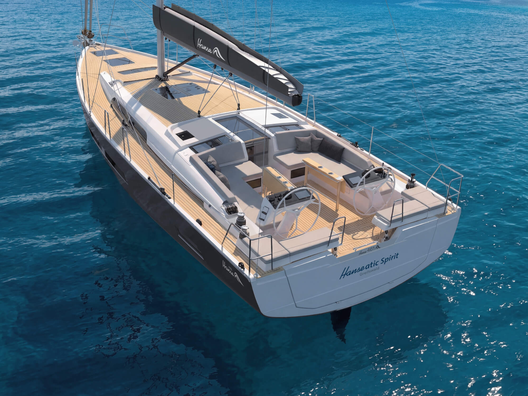 The cockpit from above and astern, with twin wheels, the central table and the mainsheet on the coachroof