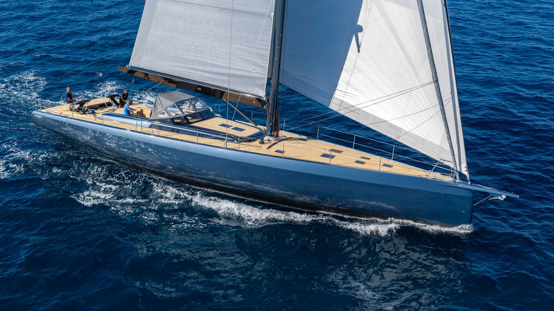The ICE 80 sailing under full main and jib, seen from abeam