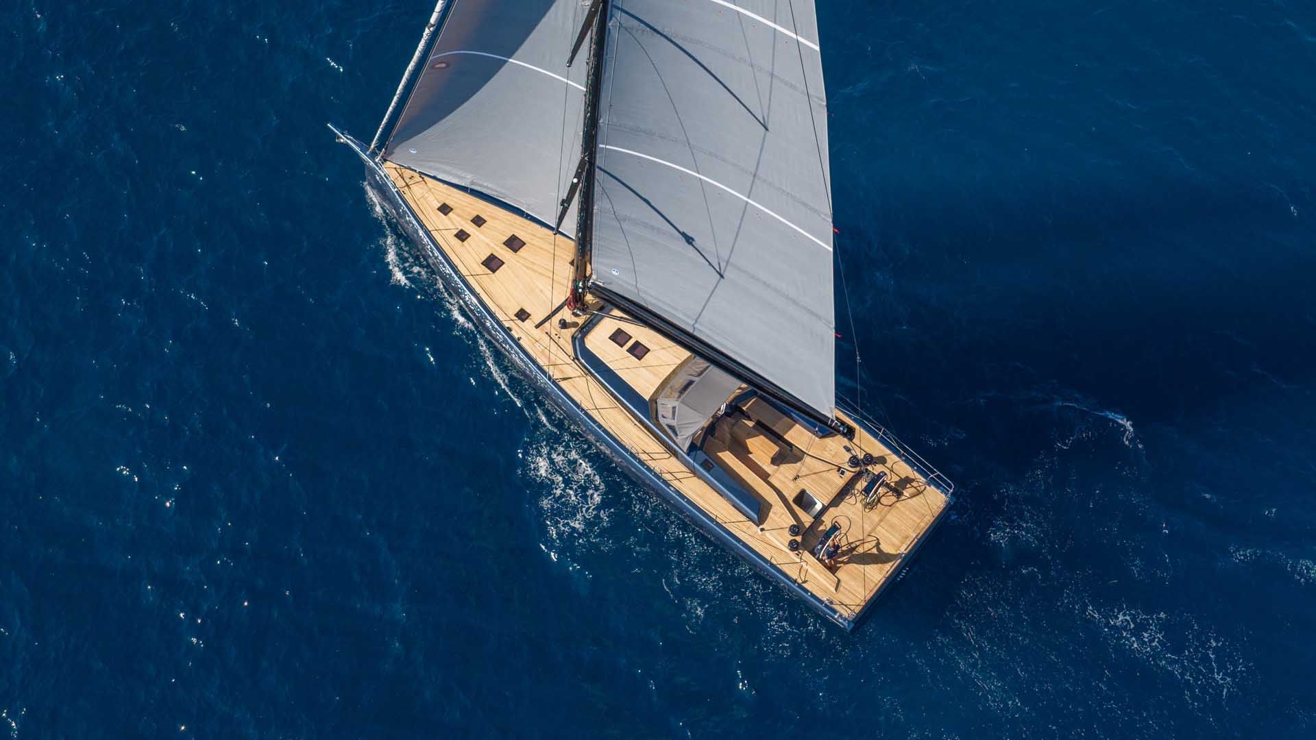 Looking straight down on the teak deck under sail, with both cockpits in view