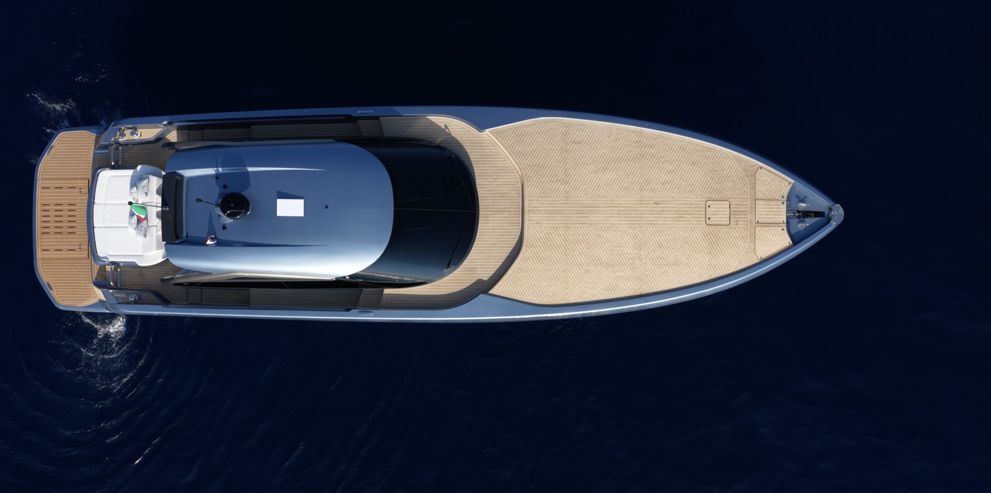 The GTO 70 seen from directly overhead, with its long teak foredeck and the hardtop over the cockpit