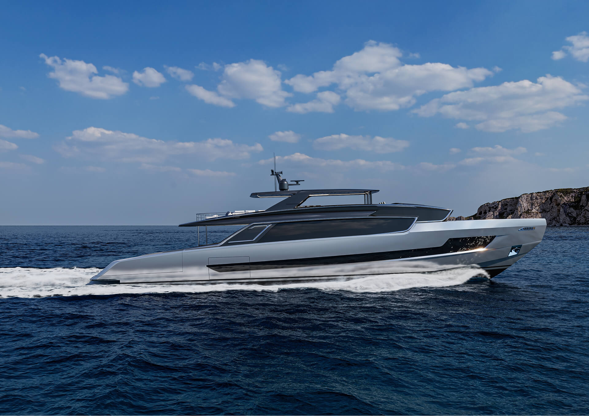 The Viper 130 under way in profile, with a rocky coast behind