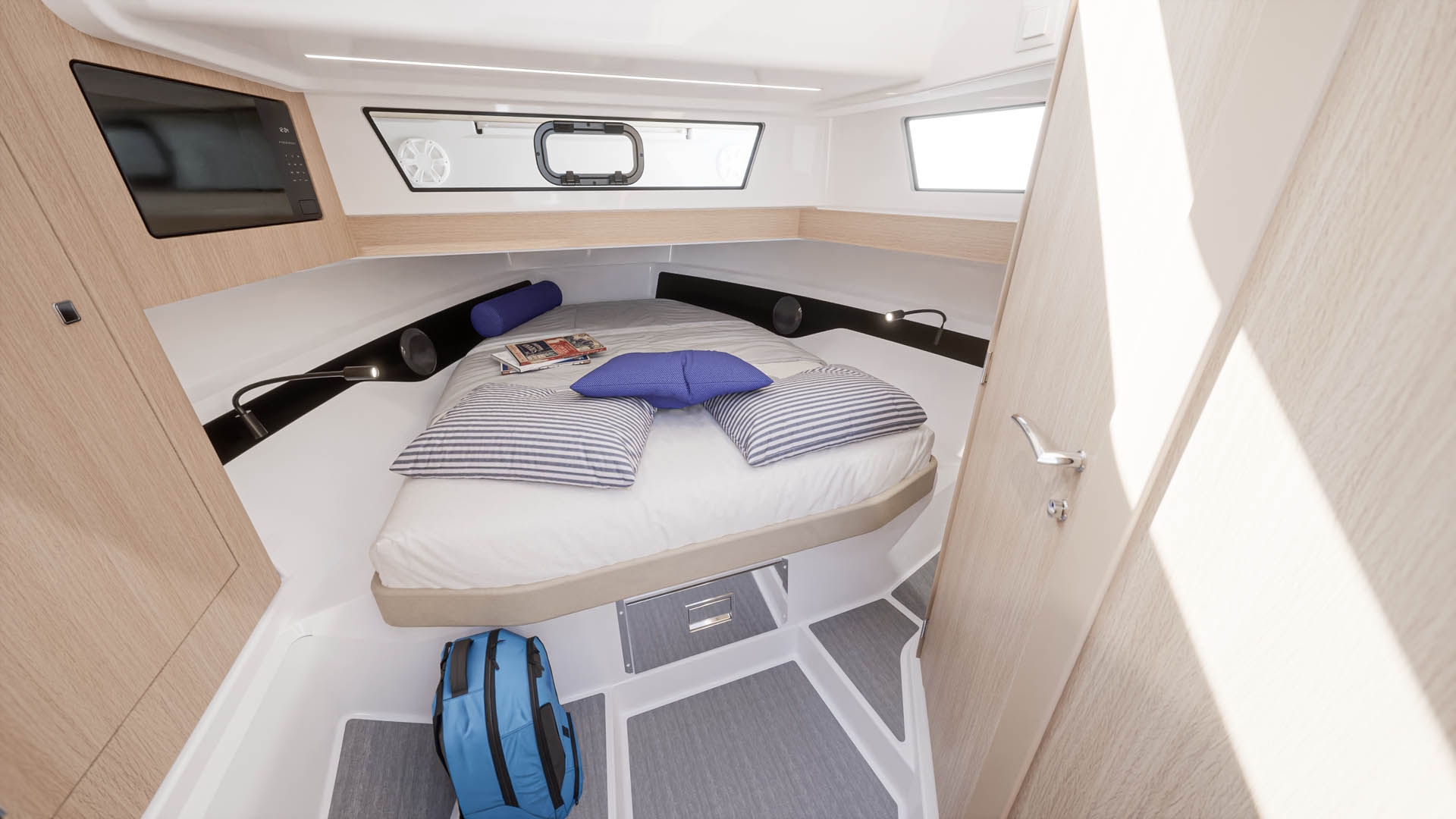 A forward cabin with a double berth under a deck hatch