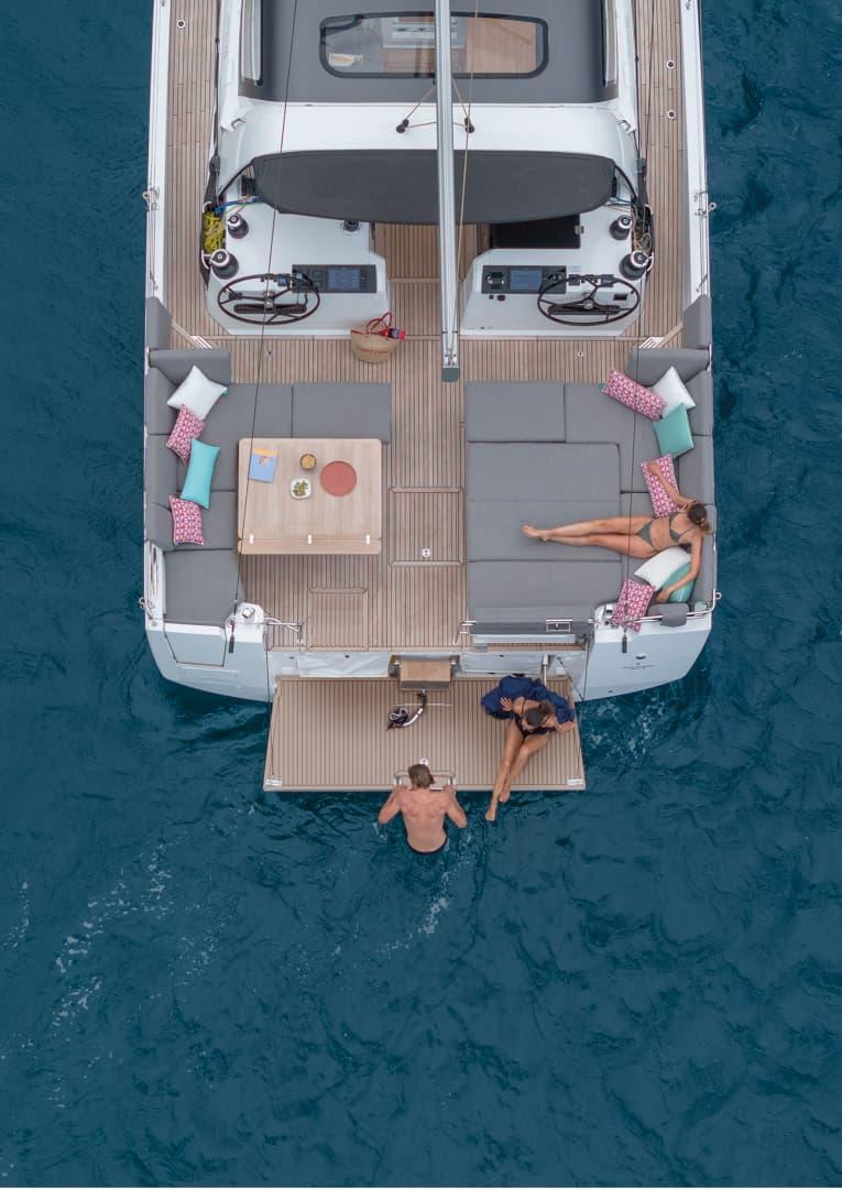 From straight above at anchor with the swim platform down and guests on it