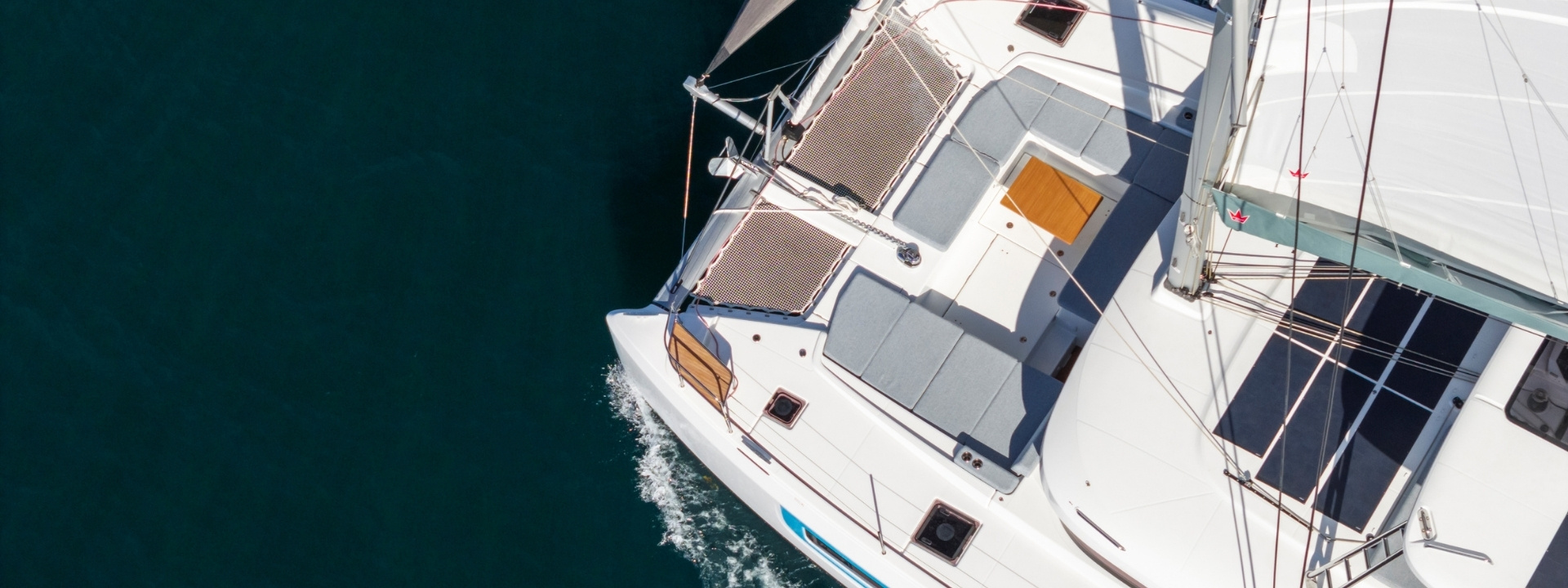 Looking straight down on the forward cockpit and trampolines while the boat is under way
