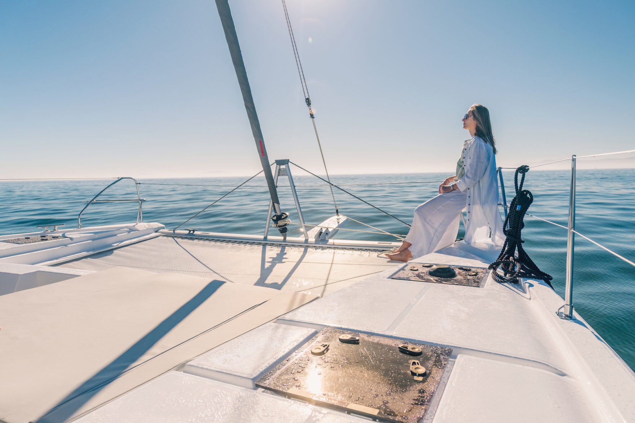The foredeck looking forward past the trampolines to open sea
