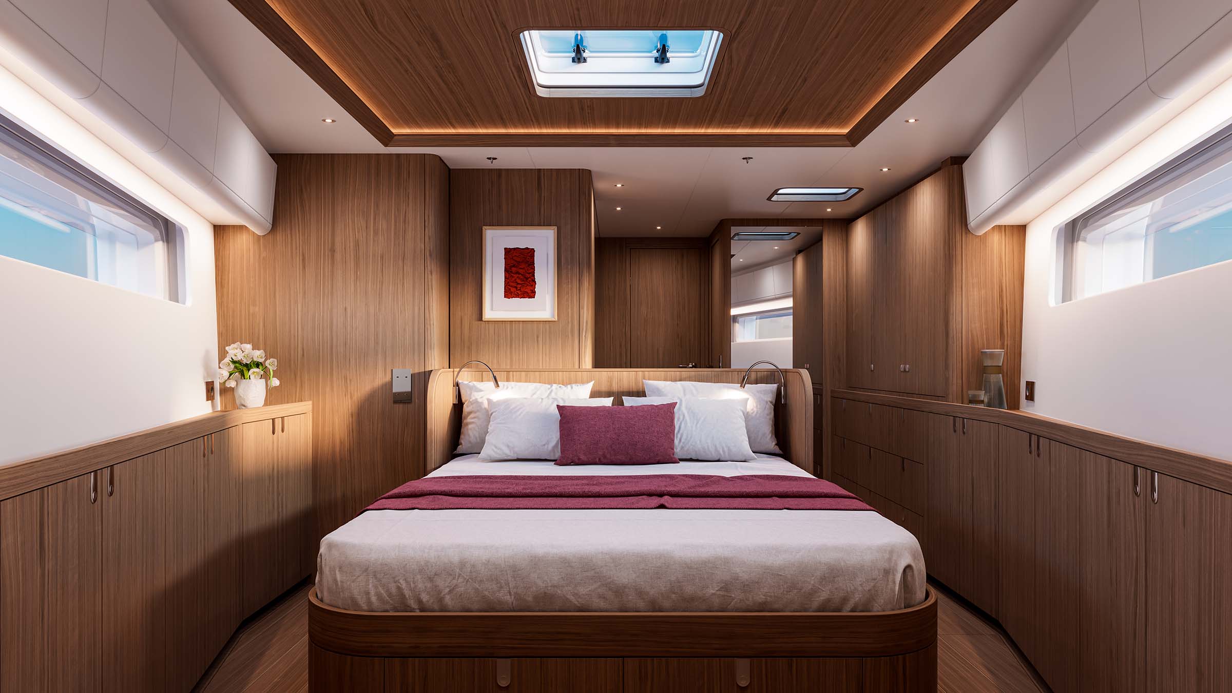 The owner's cabin in the Wine Cowes scheme, with a burgundy bedspread