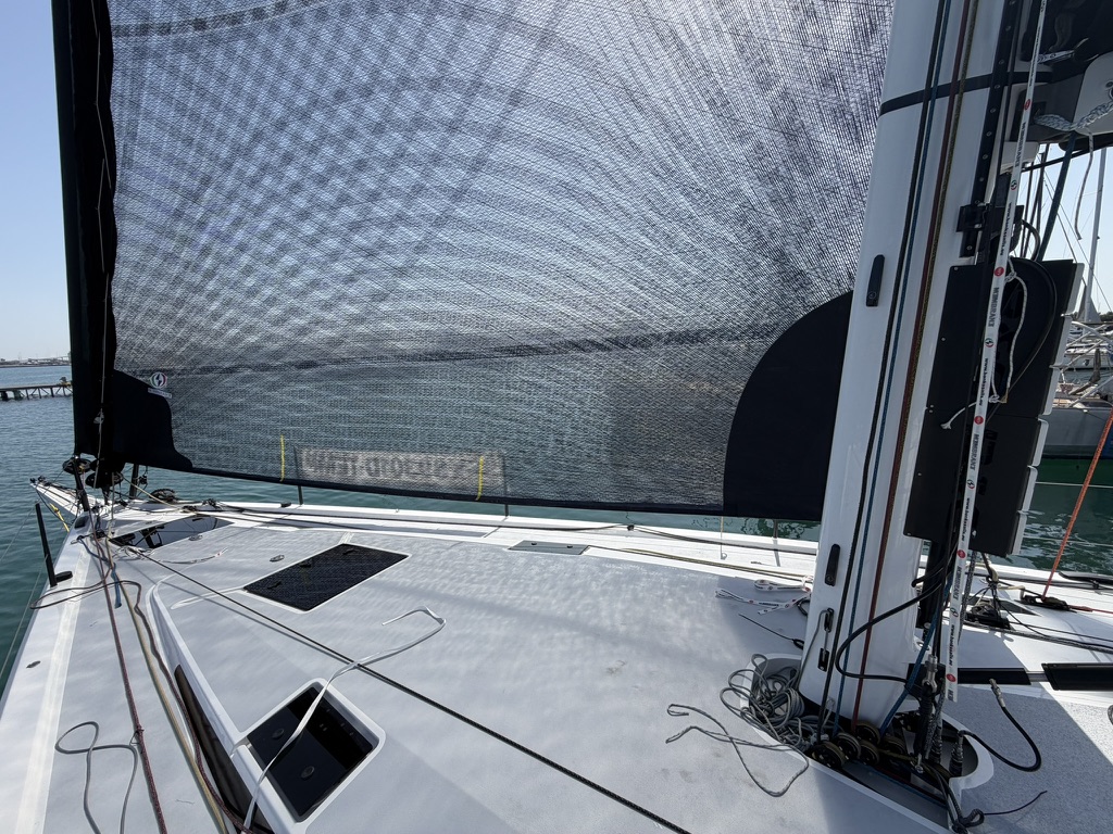 Looking forward along the deck from the cockpit, past the mast to the bow
