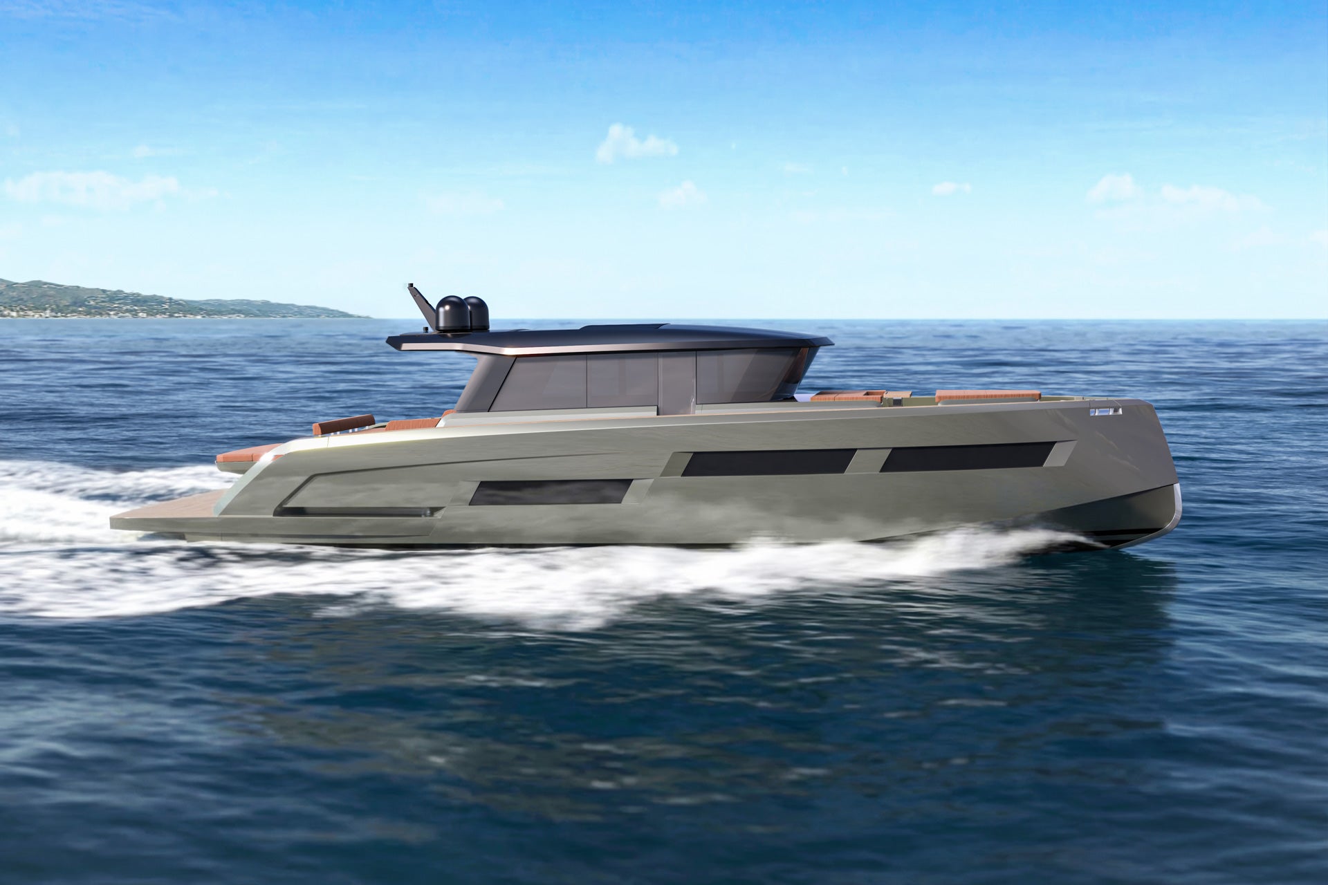 The GT65 running, throwing a wake, with a headland behind
