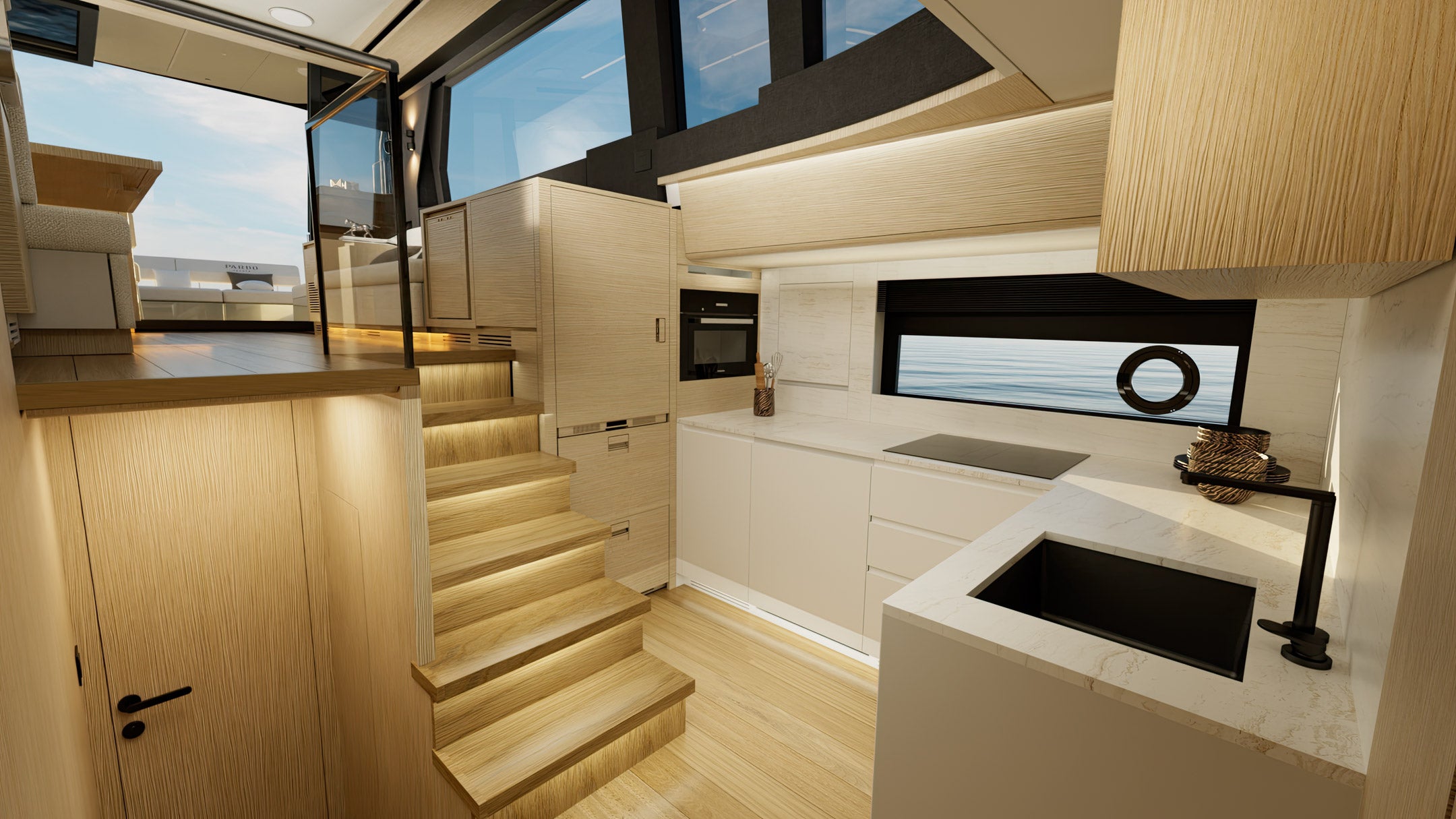 The galley half a level down, with the companionway steps beside it