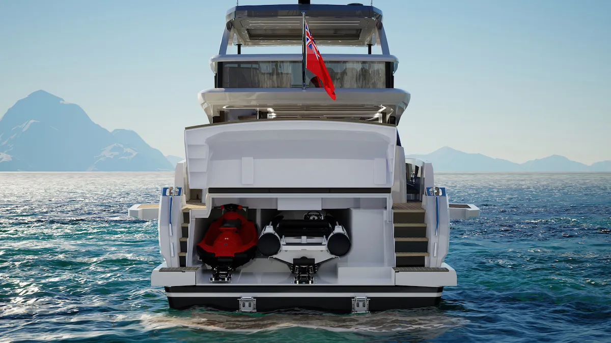 The transom garage open, with a jet ski and a tender inside