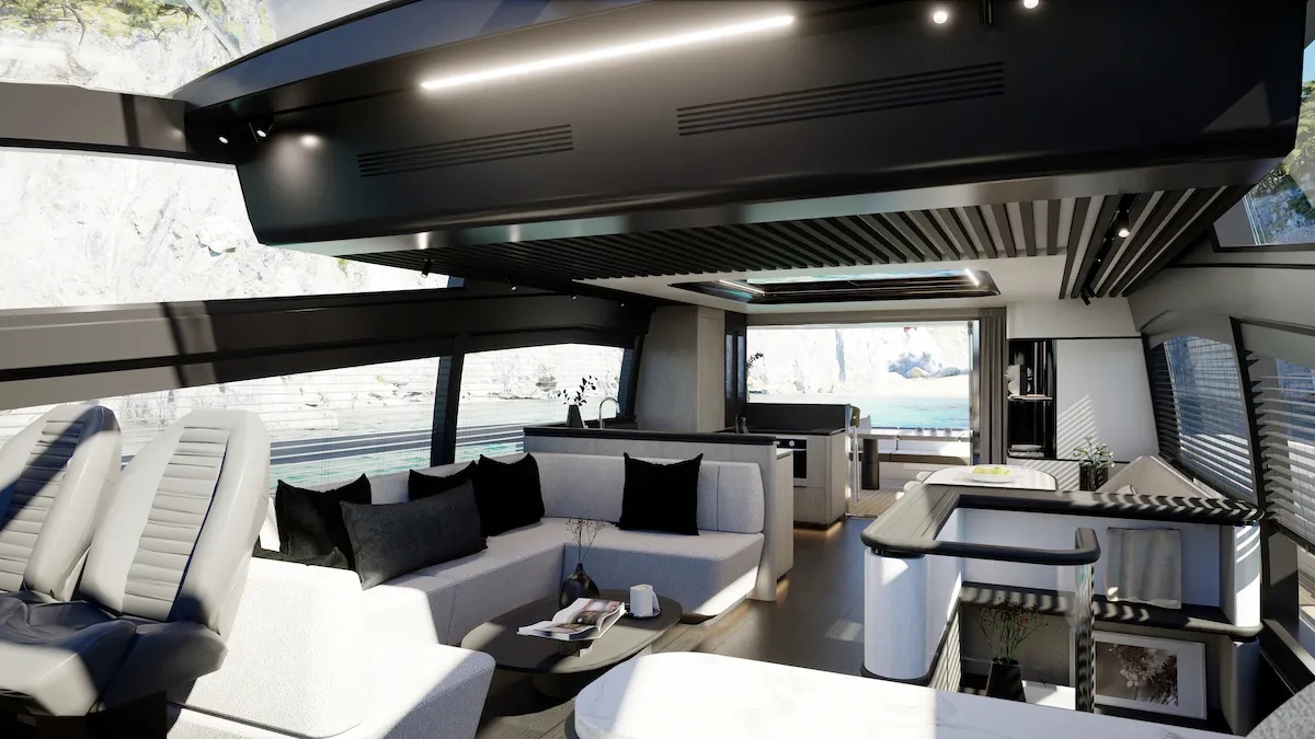 The saloon looking aft, with pale seating and the galley beyond