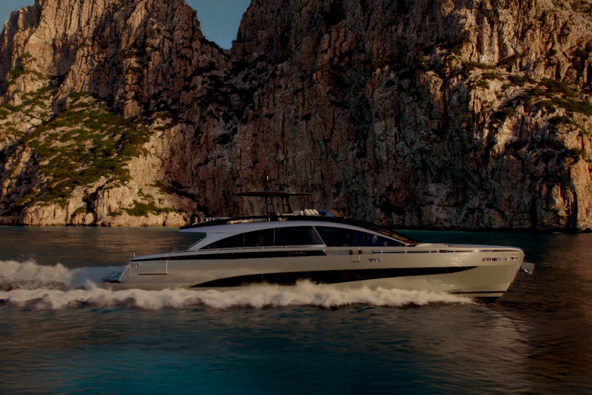 The Pershing GTX90 running from right to left below a high rock face in warm evening light, her long low superstructure and dark window band stretching most of her length