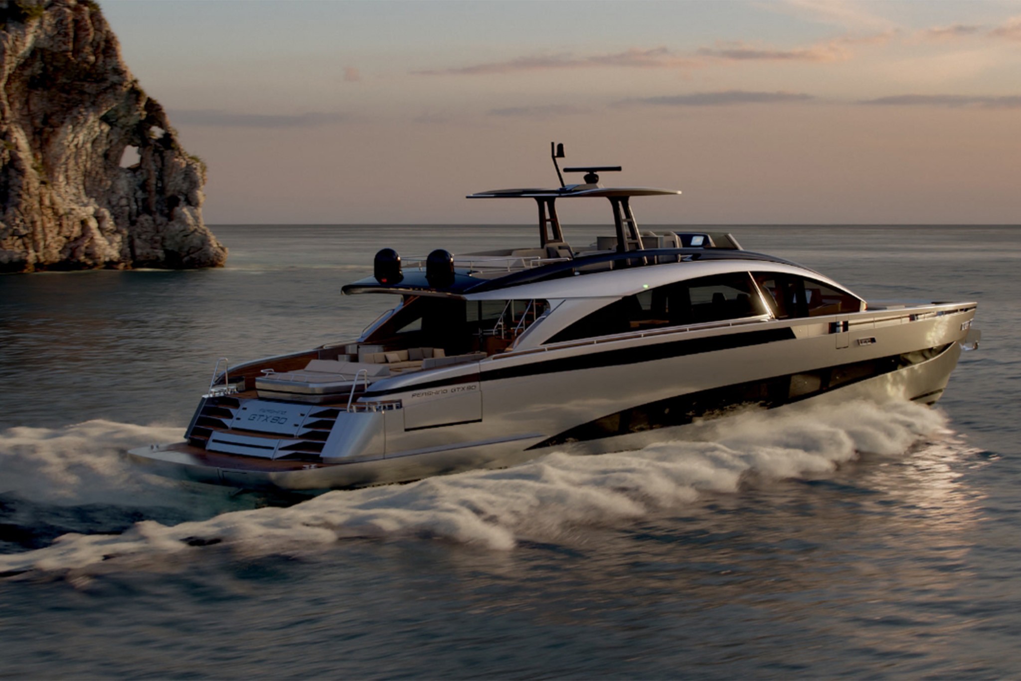 The Pershing GTX90 seen from astern and to one side at speed in pale evening light, GTX90 lettering on the transom, a sea stack on the horizon behind her