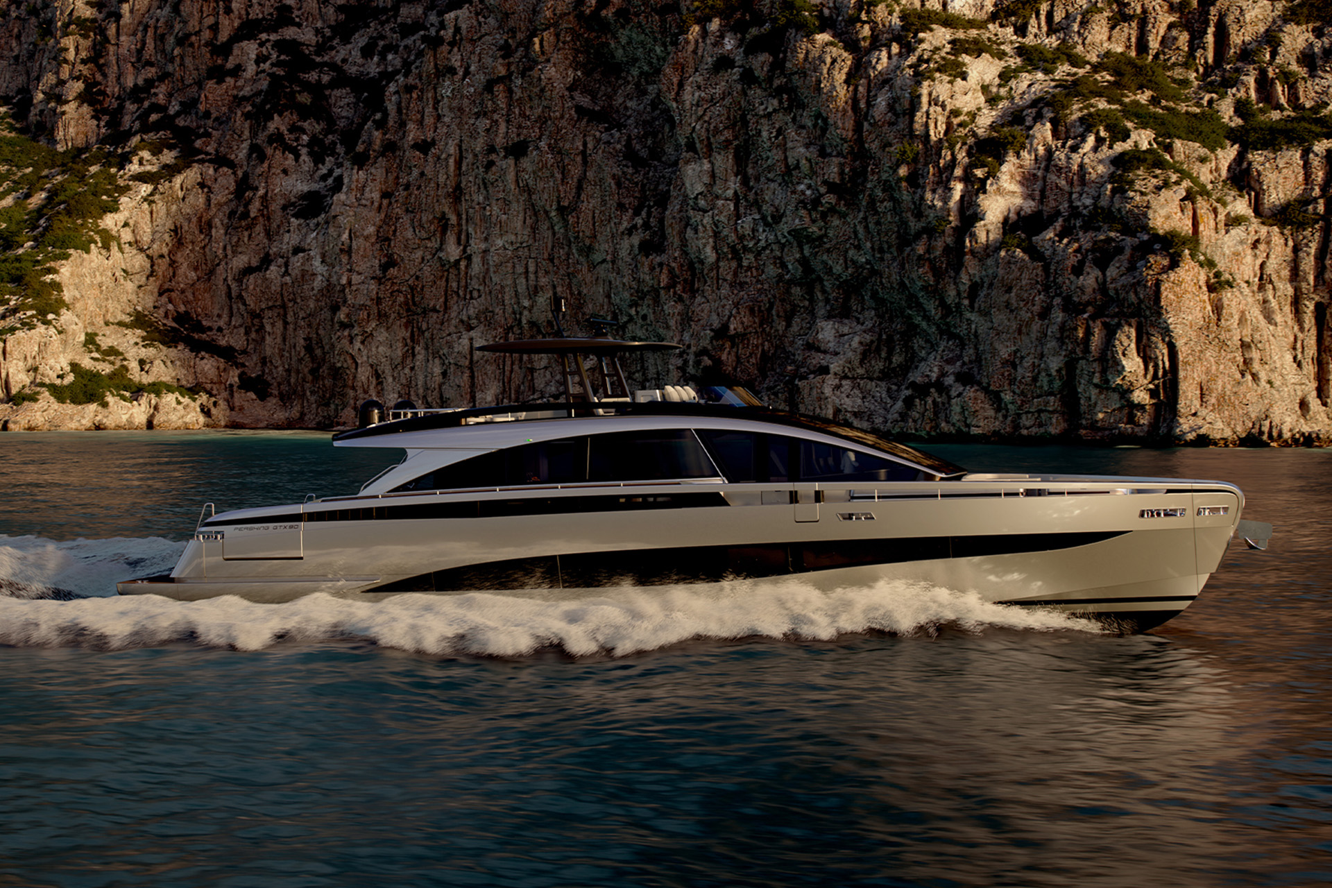 The Pershing GTX90 running to the left in evening light below a steep rock face, her name on the hull side and a wake curling away astern