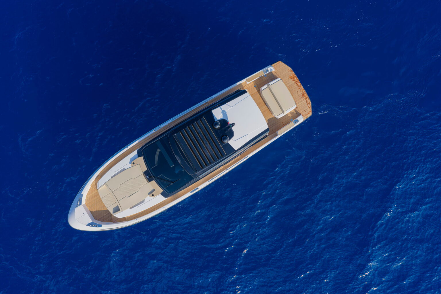The Sport Coupé 50 from directly above at rest, showing the teak cockpit and foredeck