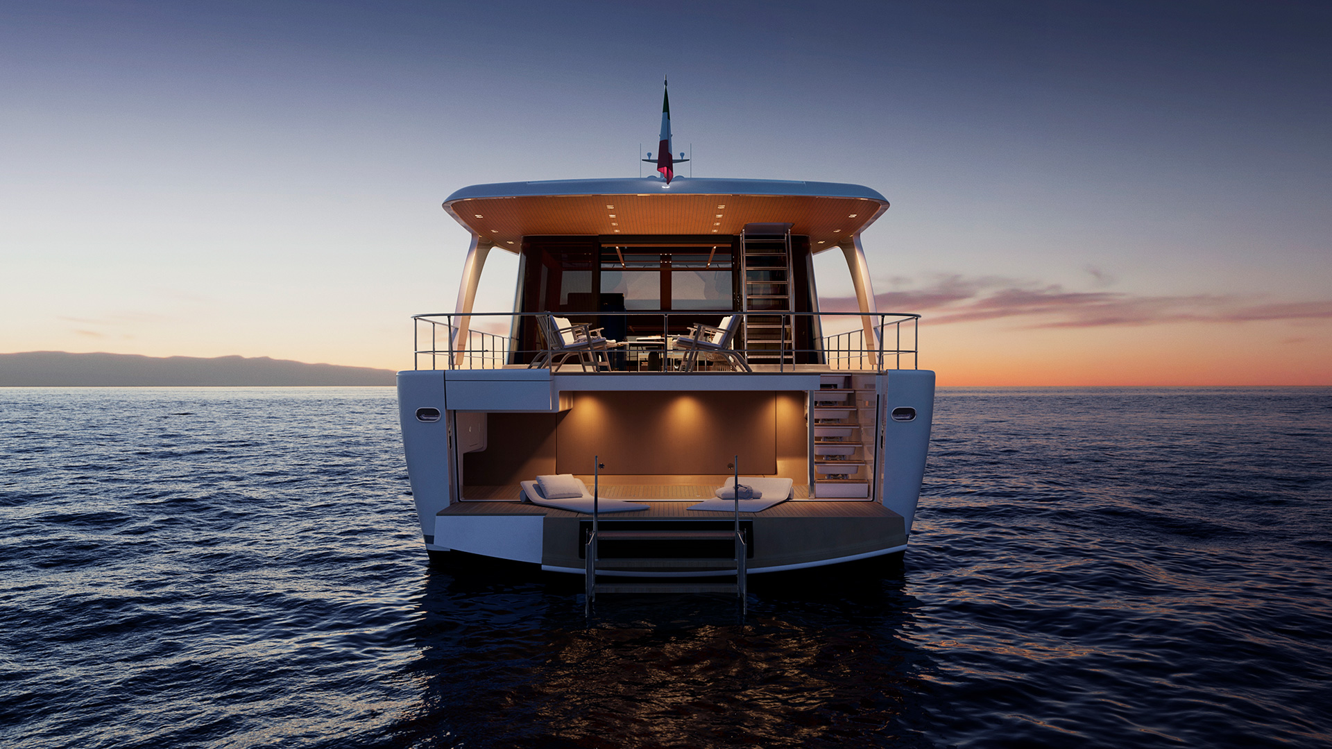 The stern at dusk, with the beach area open and the interior glowing