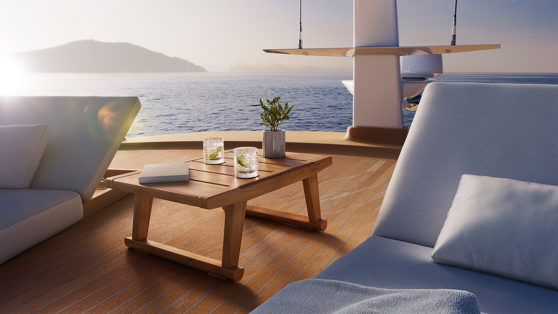 A shaded deck seating area with a teak table, looking out to a headland